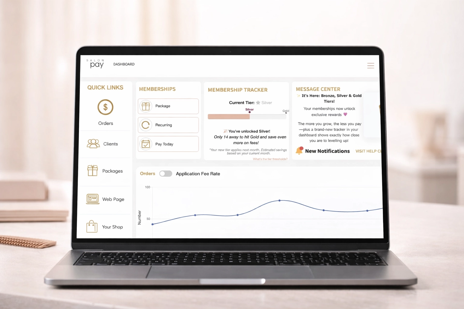 Salon Pay dashboard displayed on a sleek modern laptop on a clean salon desk