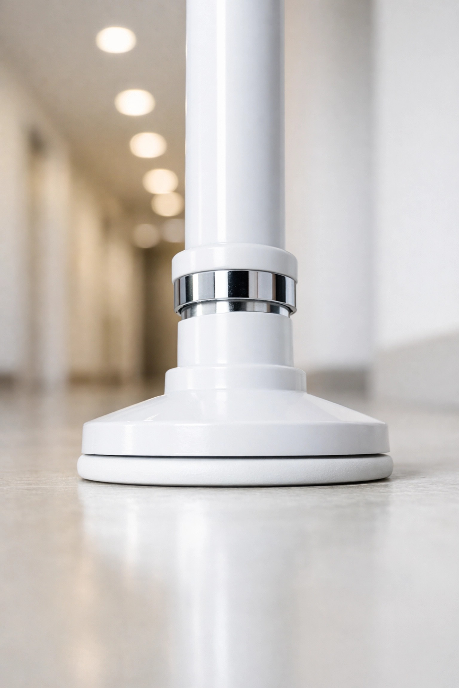 Detailed view of the base of a tension-mounted independence pole for secure fall prevention.