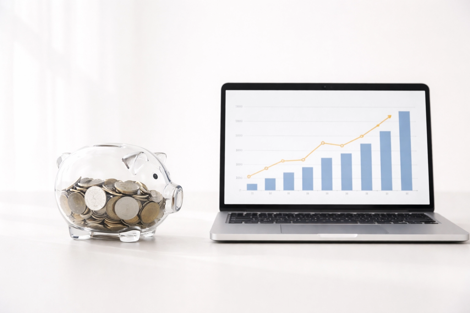 Transparent piggy bank and laptop showing clear pricing for business IT services costs