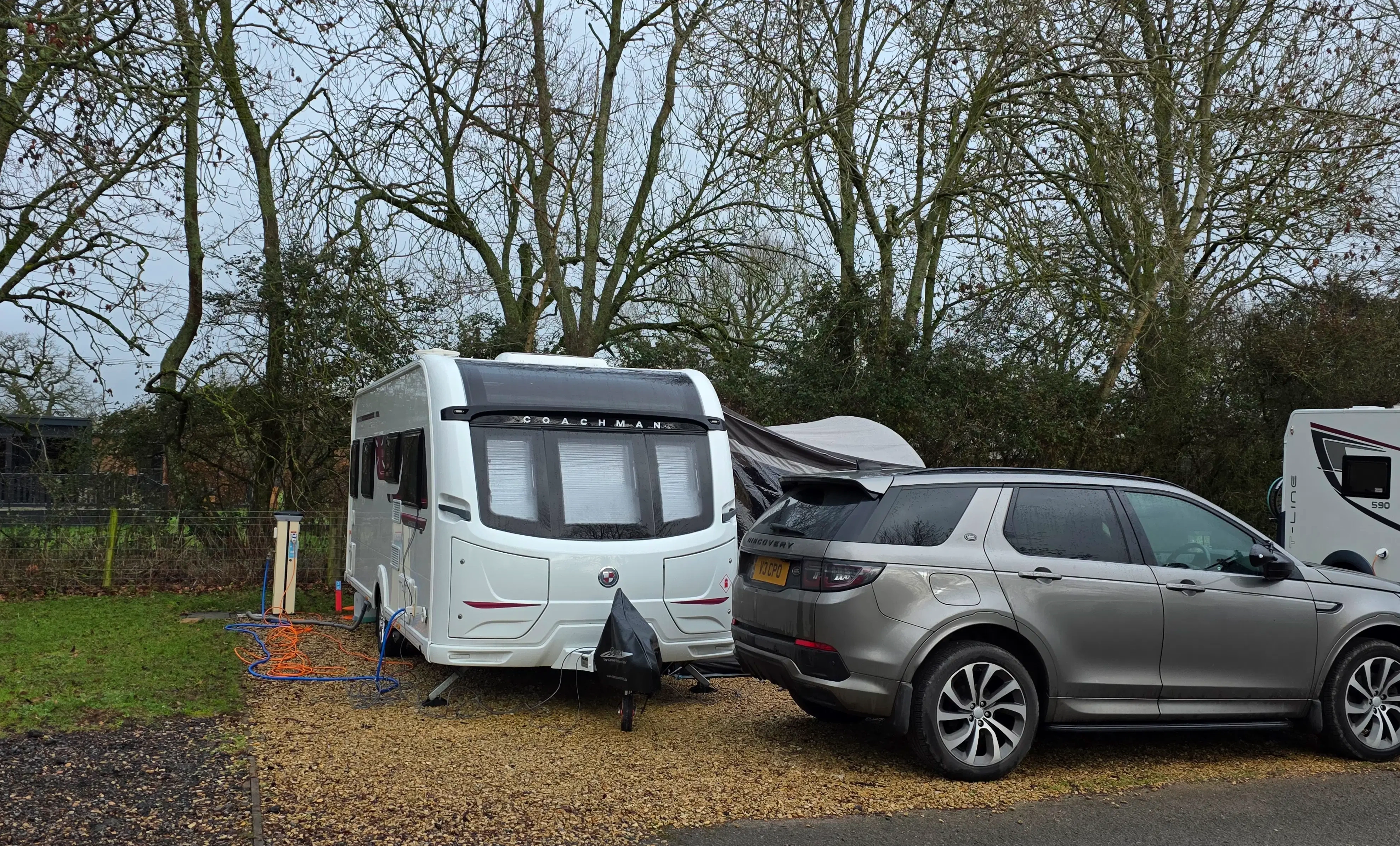 A spacious hardstanding pitch at Moreton-in-Marsh Club Campsite in winter.