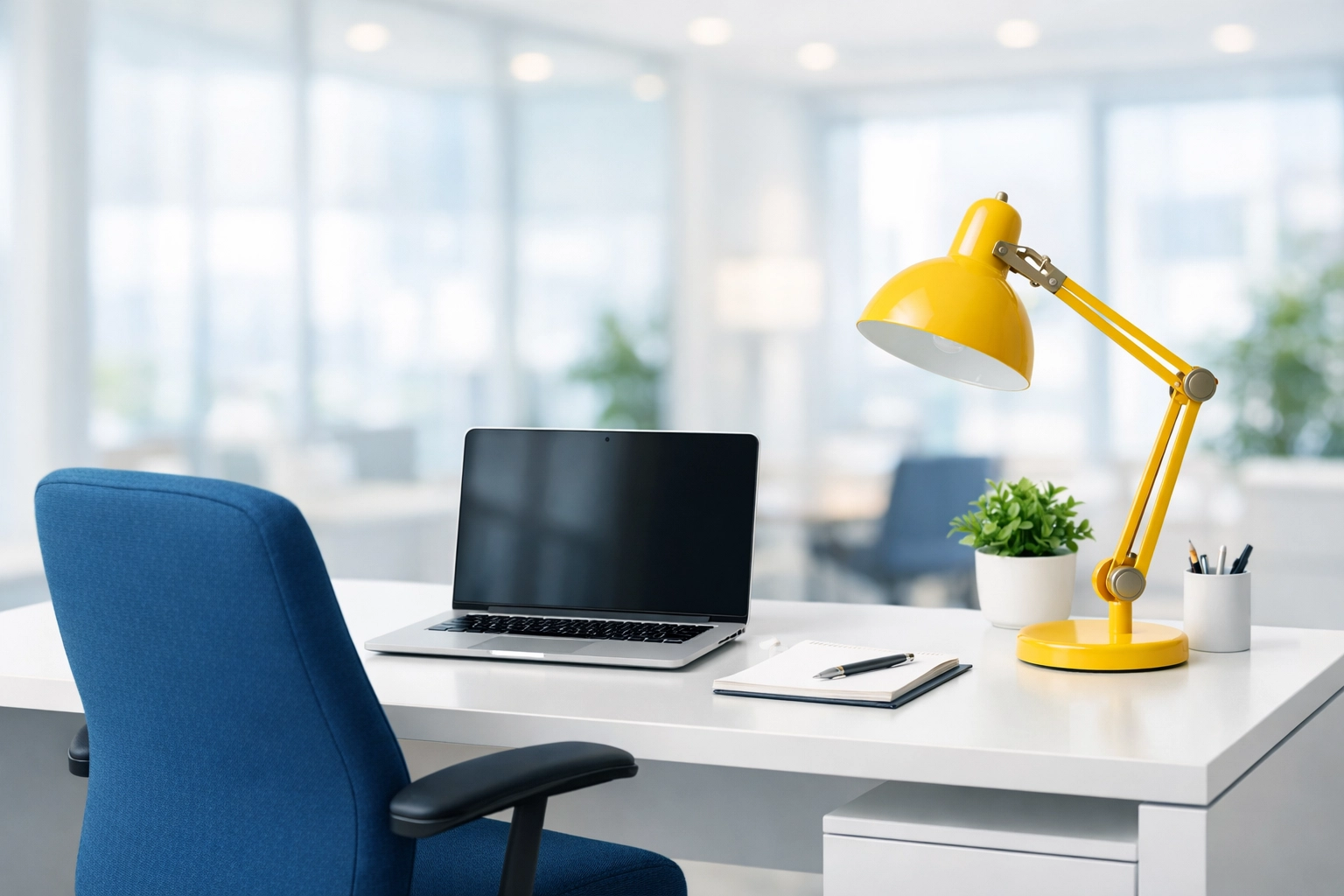 Professional office cleaning in Bedford ensures a dust-free workstation with a clean white desk and blue chair.