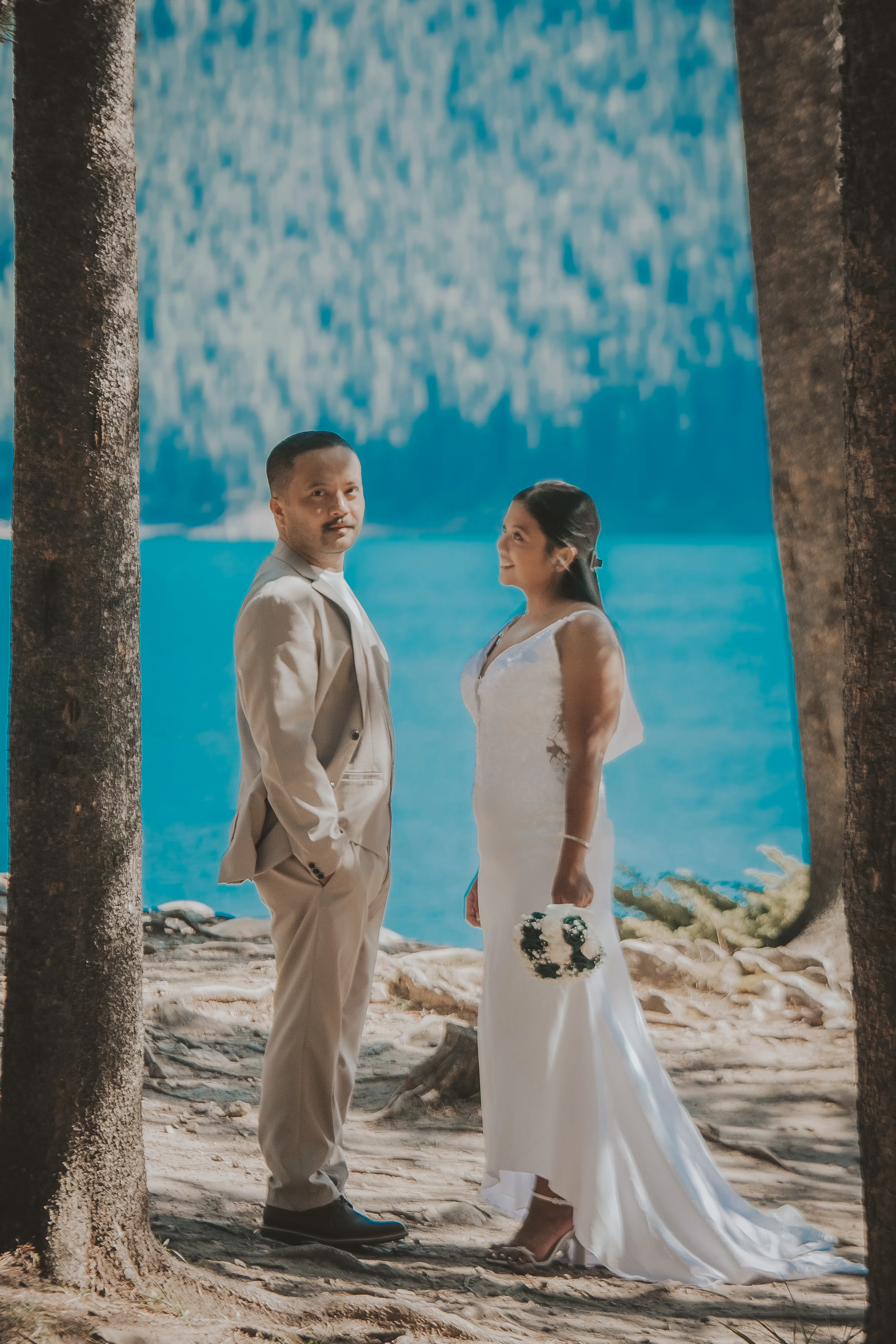 Couple in wedding attire in the Canadian Rockies