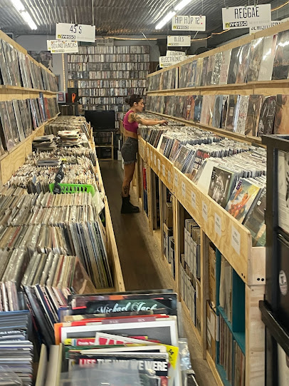 Customer Browsing Vinyl at Nivessa