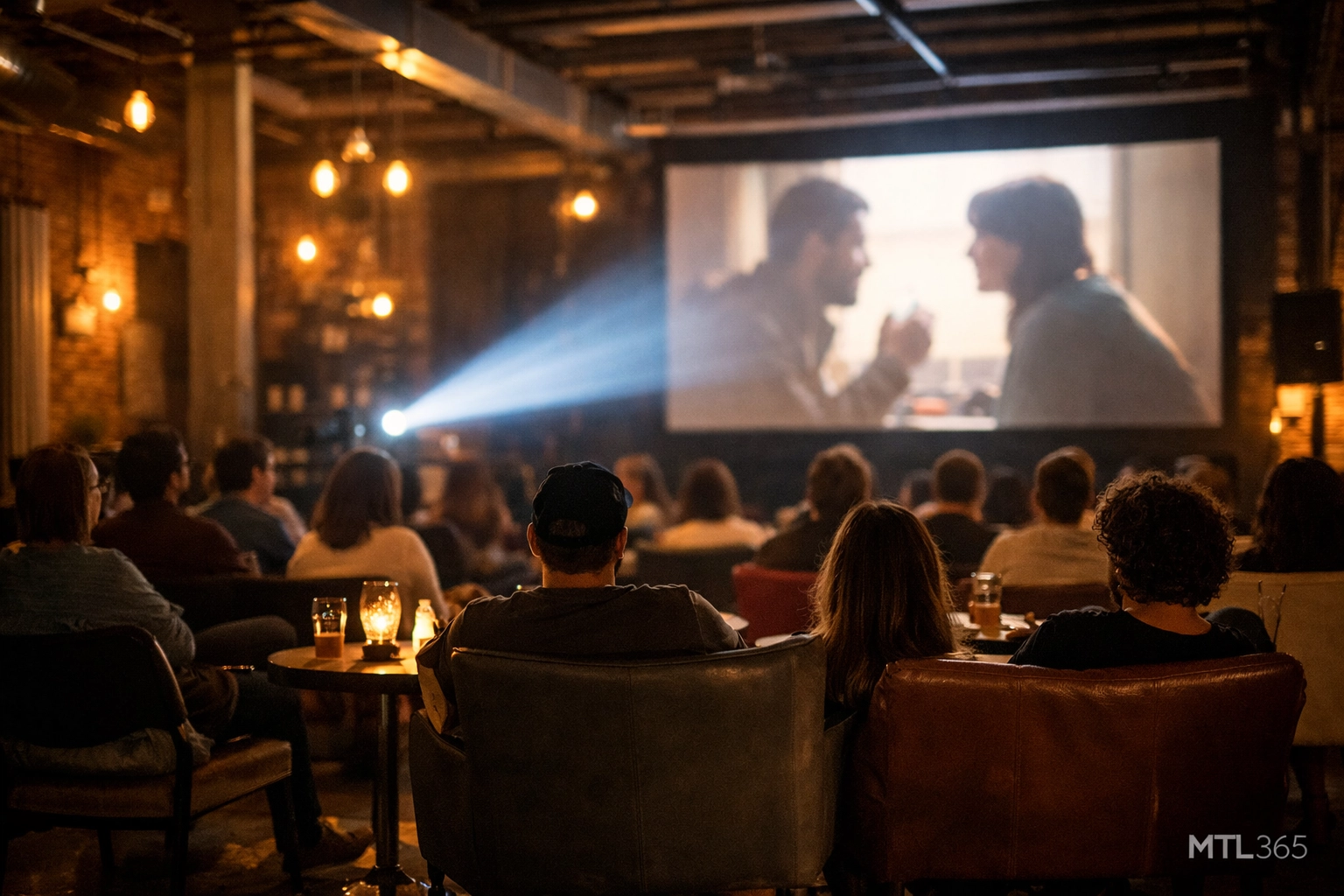 Audience watching independent films at the Filministes Festival in a modern Montreal event space.