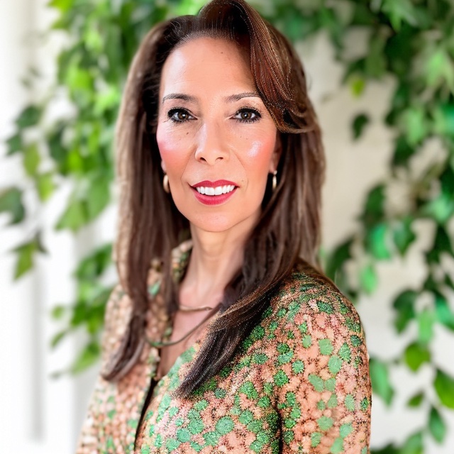 Professional headshot of a woman in business attire