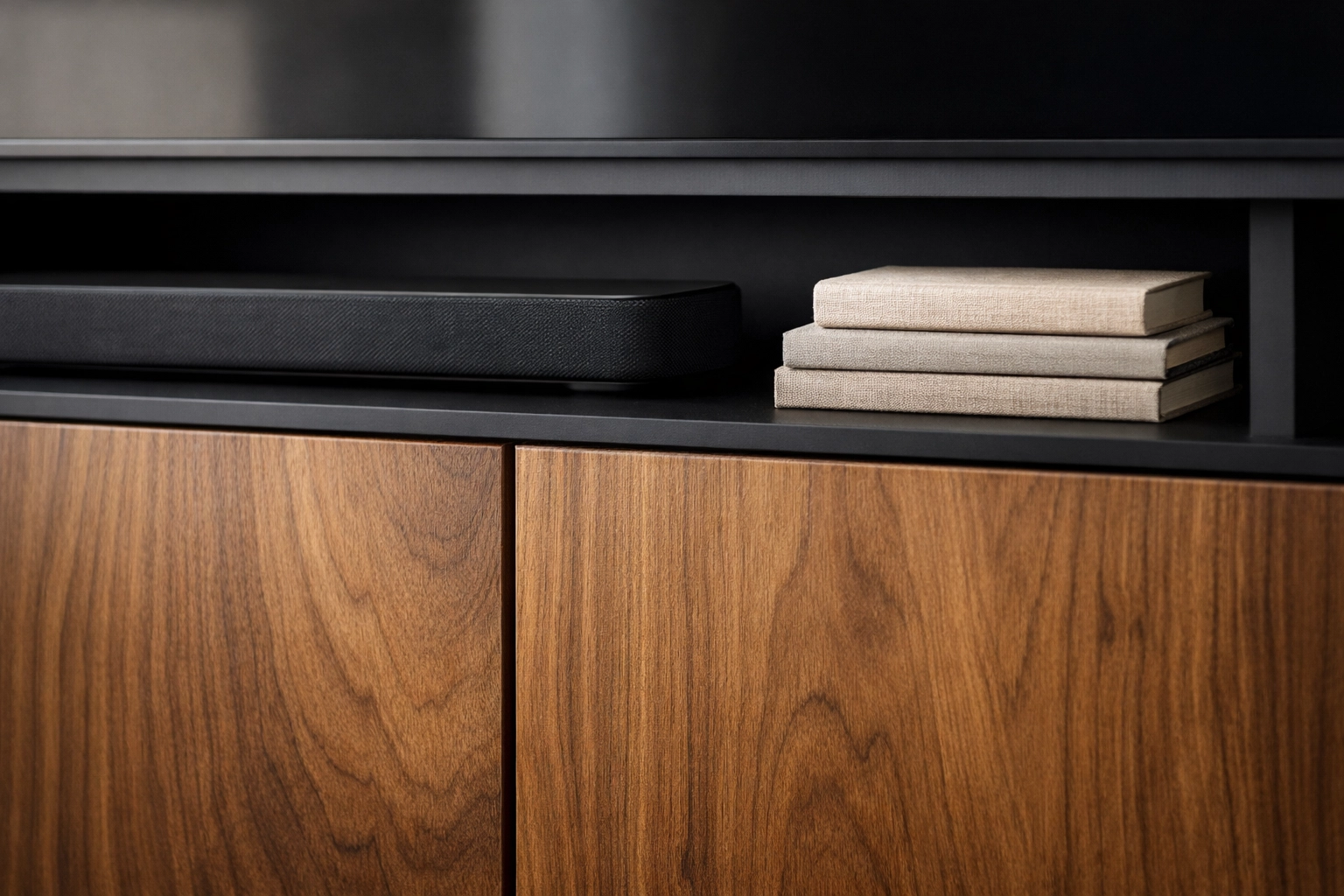 Minimalist media console with wood cabinets and organized shelving for a clutter-free living room design.
