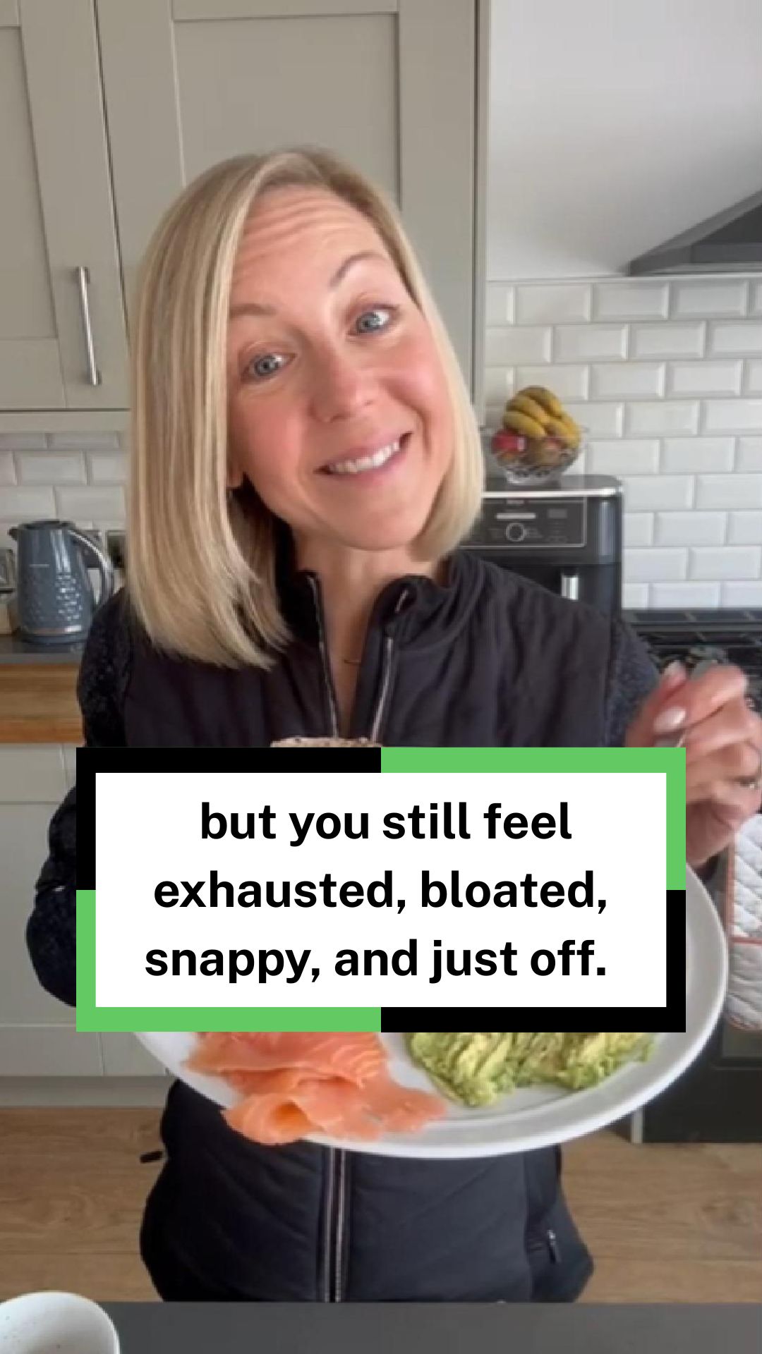 A woman with salmon and avocado in a kitchen