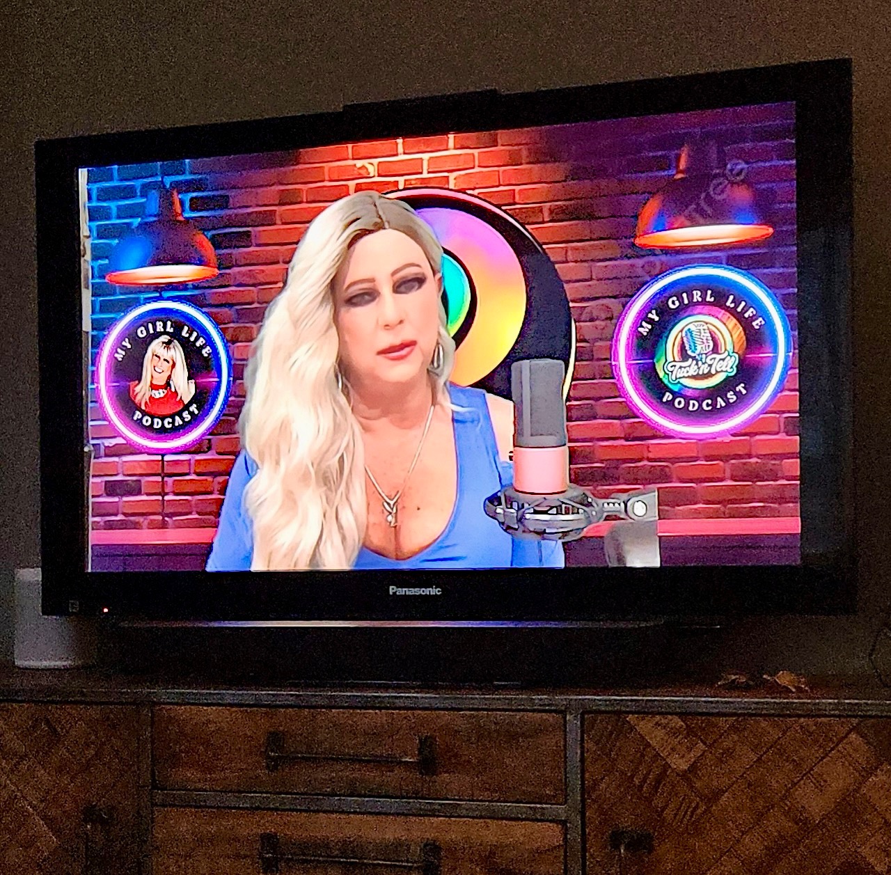 Maddie Taylor smiling warmly in a bright, welcoming portrait, inviting trans women and crossdressers to share their stories.