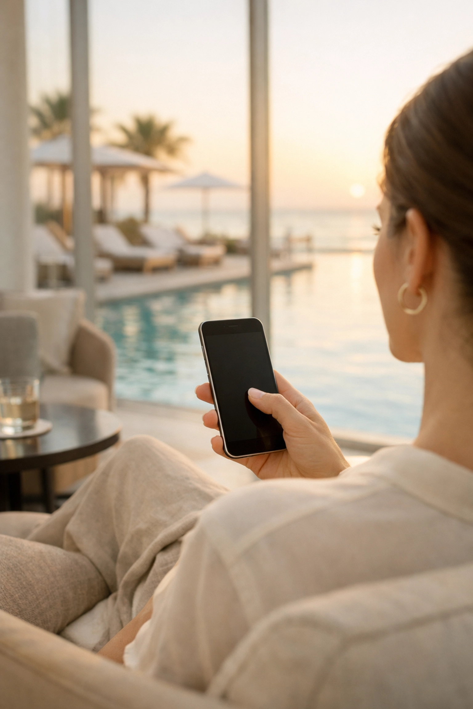 Hotel guest using a mobile booking engine on a smartphone to accept a personalized late check-out.