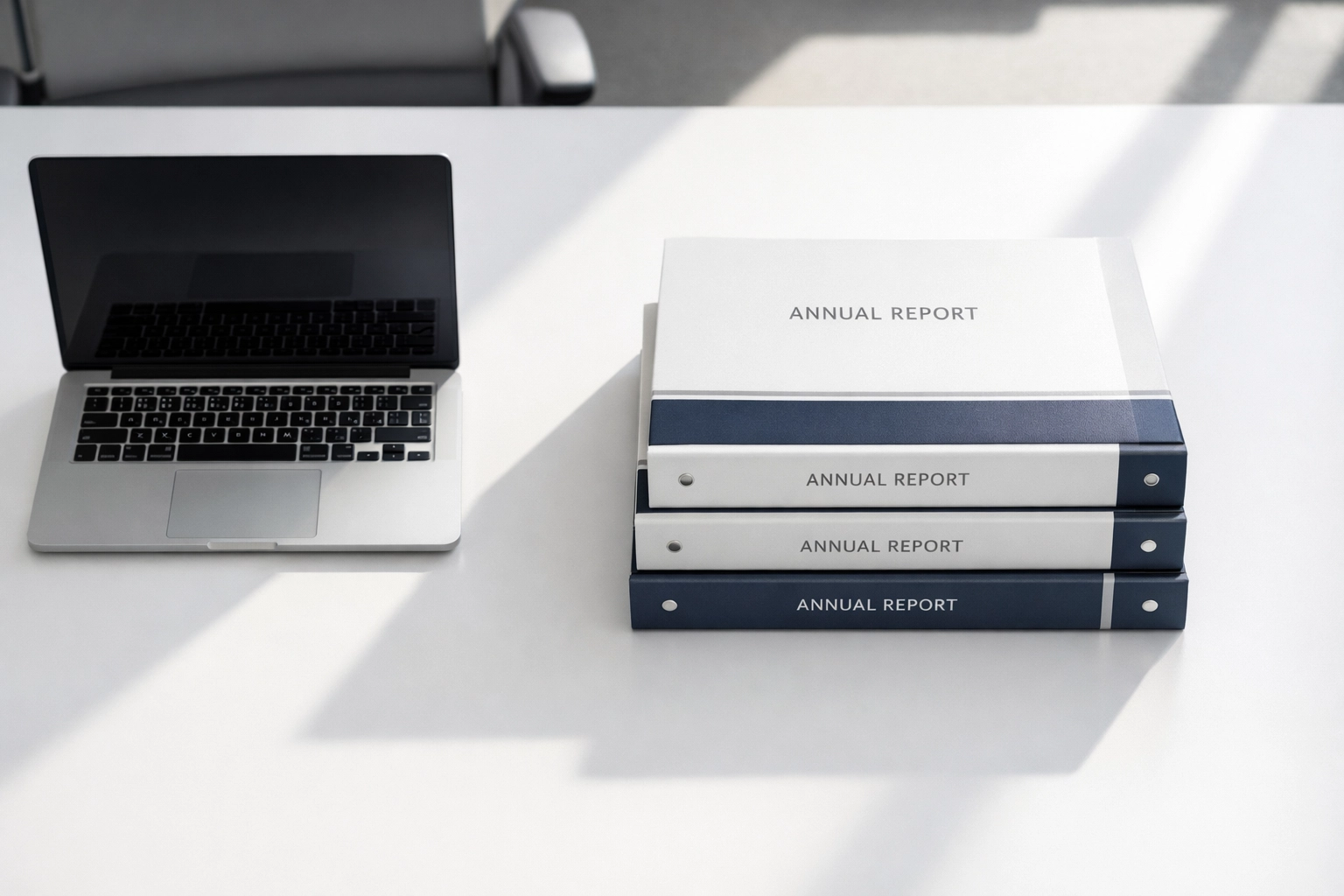 Standardized marketing report binders on a modern office desk for consistent campaign KPI tracking.