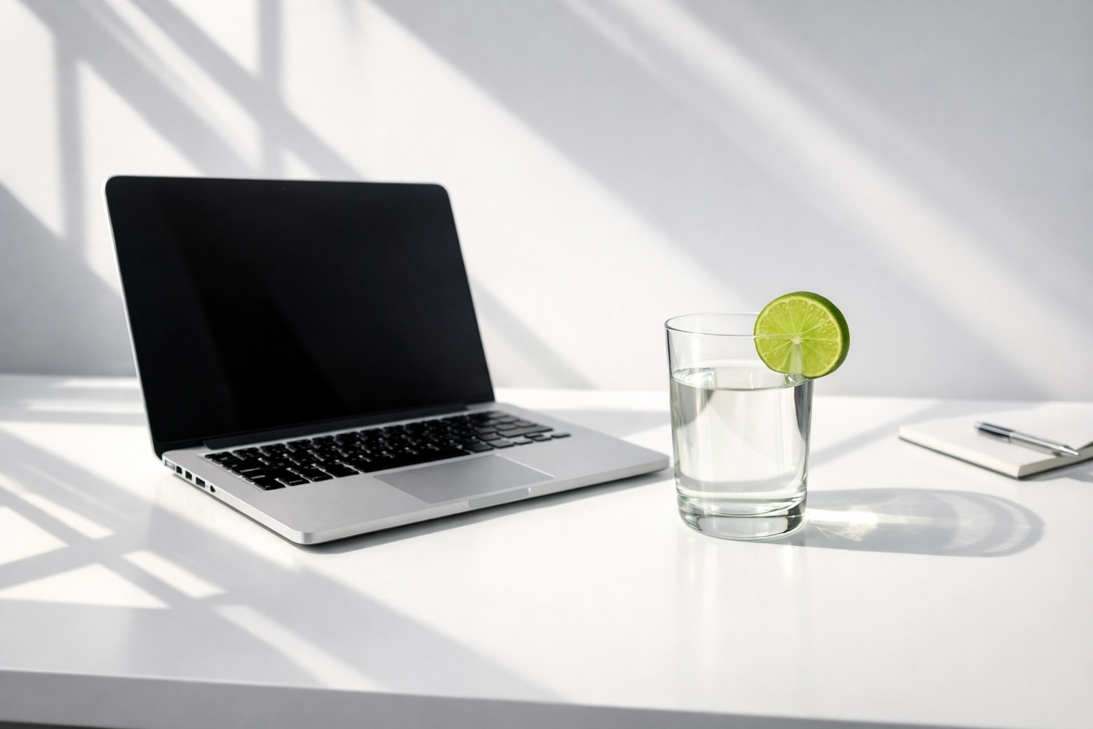 Modern minimalist workspace with a laptop representing steady small business website growth and consistency.