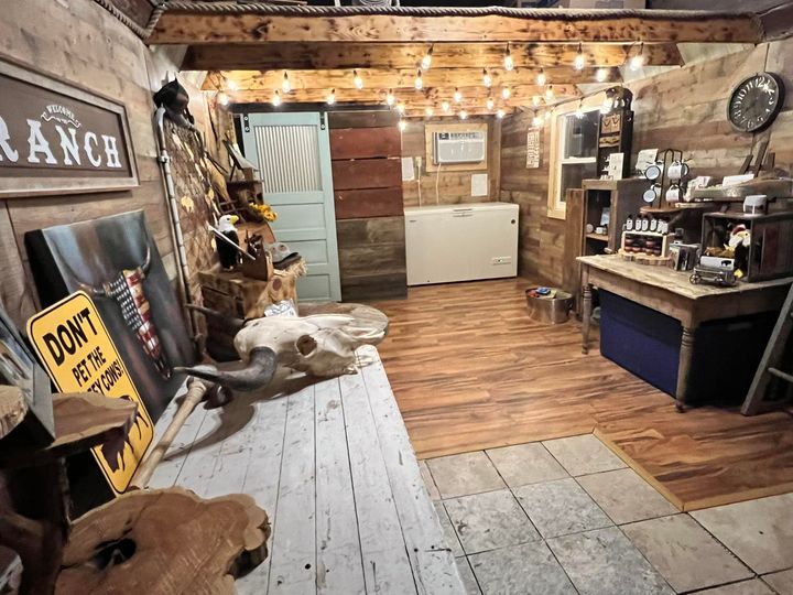 The ranch gift shop features rustic wood walls and bison decor