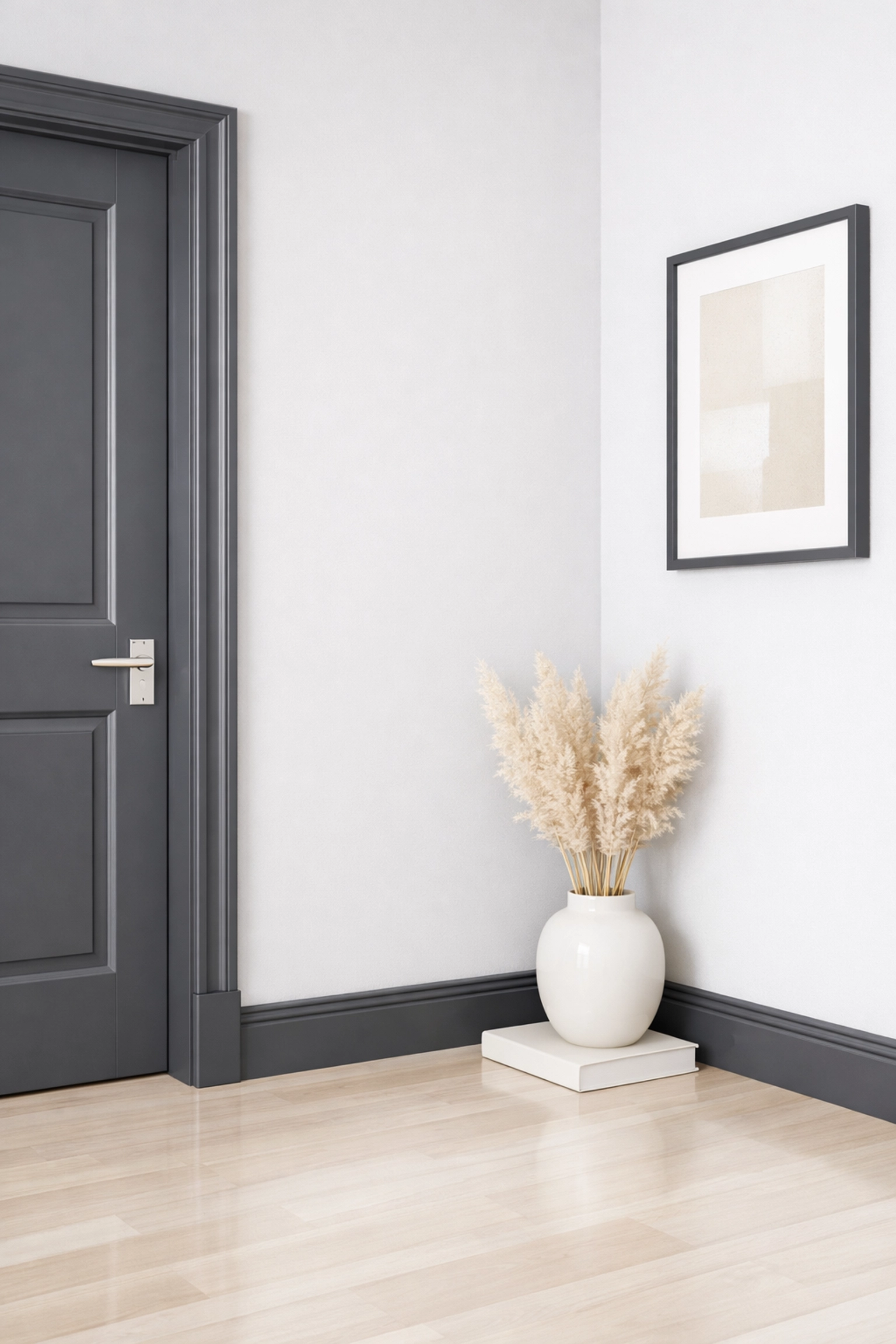 Dark grey painted skirting boards and door frames in a modern Cheltenham hallway.