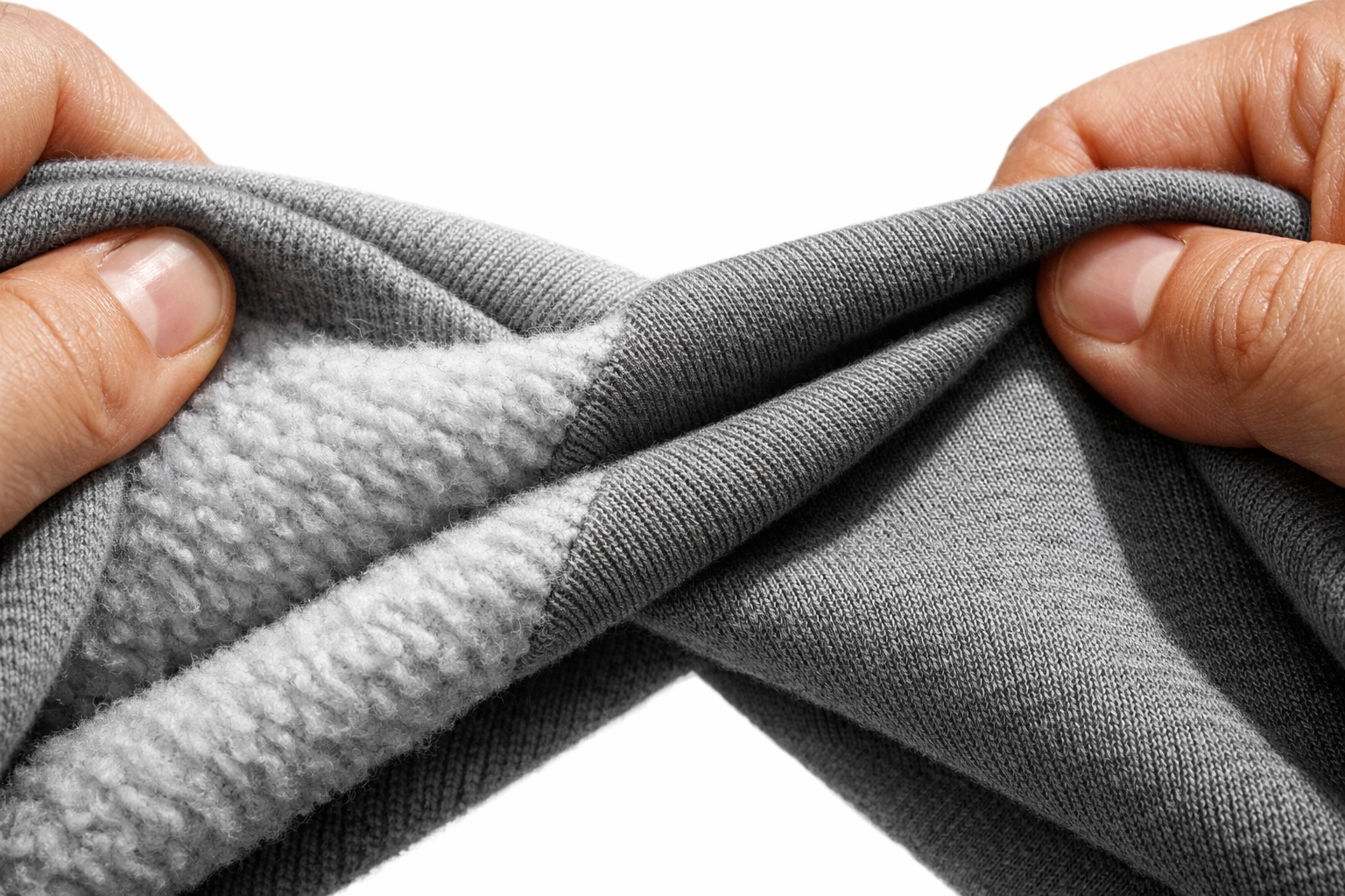 Close-up of soft cotton hoodie fabric showing brushed fleece interior and durable exterior texture