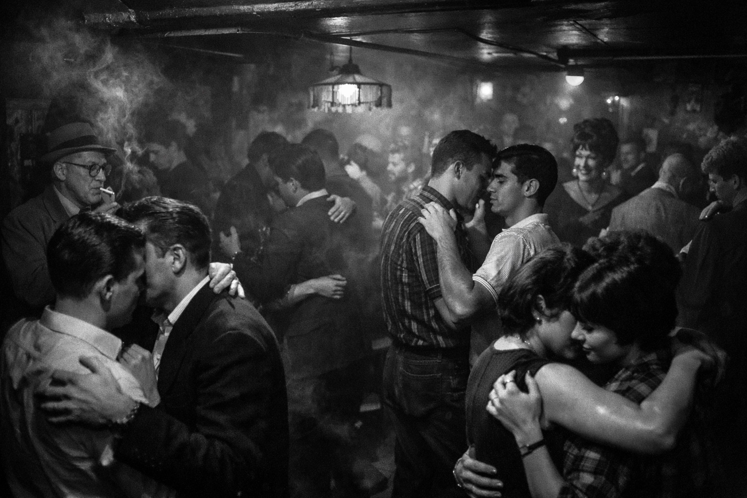 Underground gay bar in 1960s Greenwich Village before Stonewall with LGBTQ+ patrons dancing