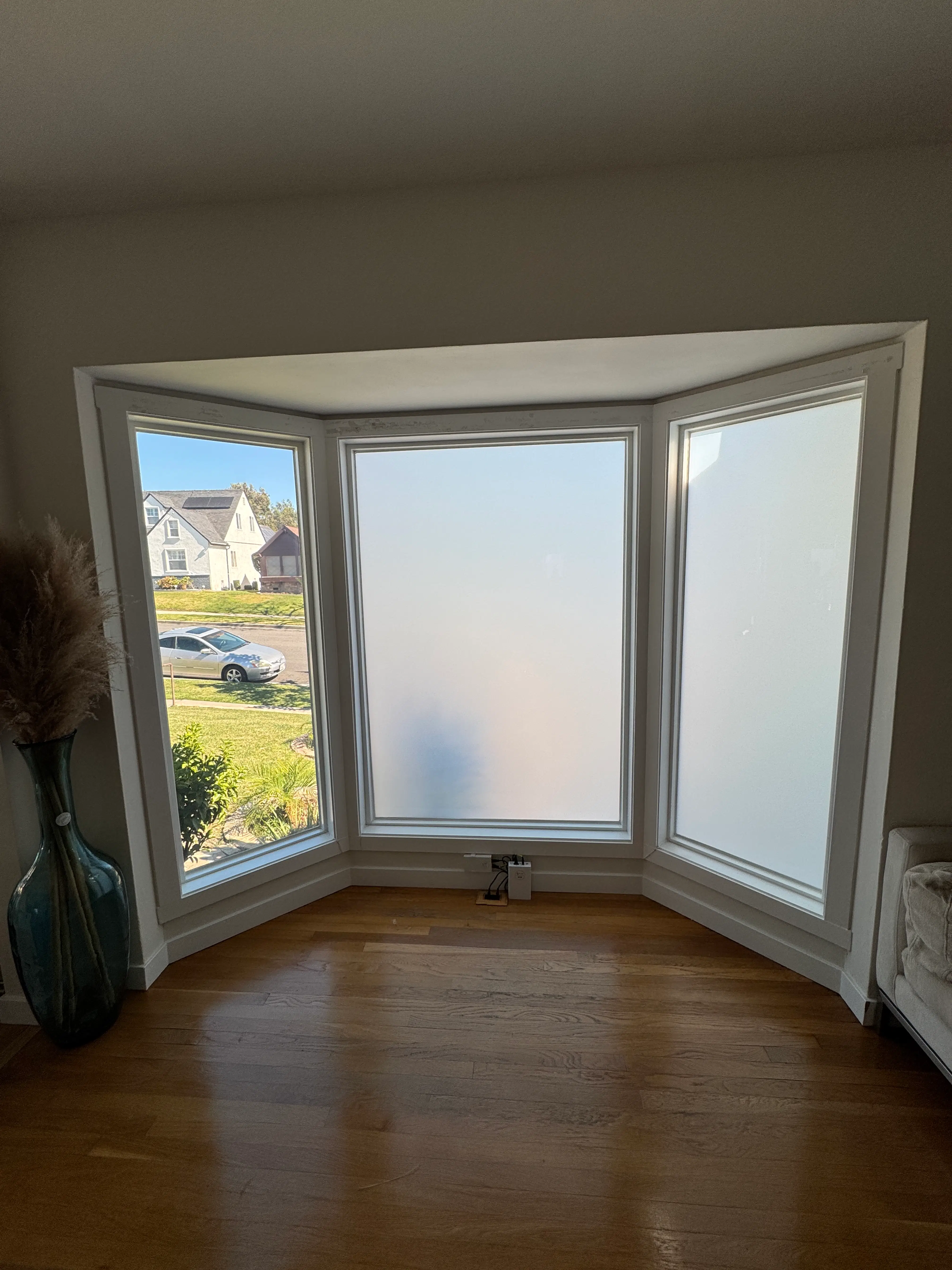 Three-panel bay window fitted with Smart View Smart Film showcasing instant switchable privacy