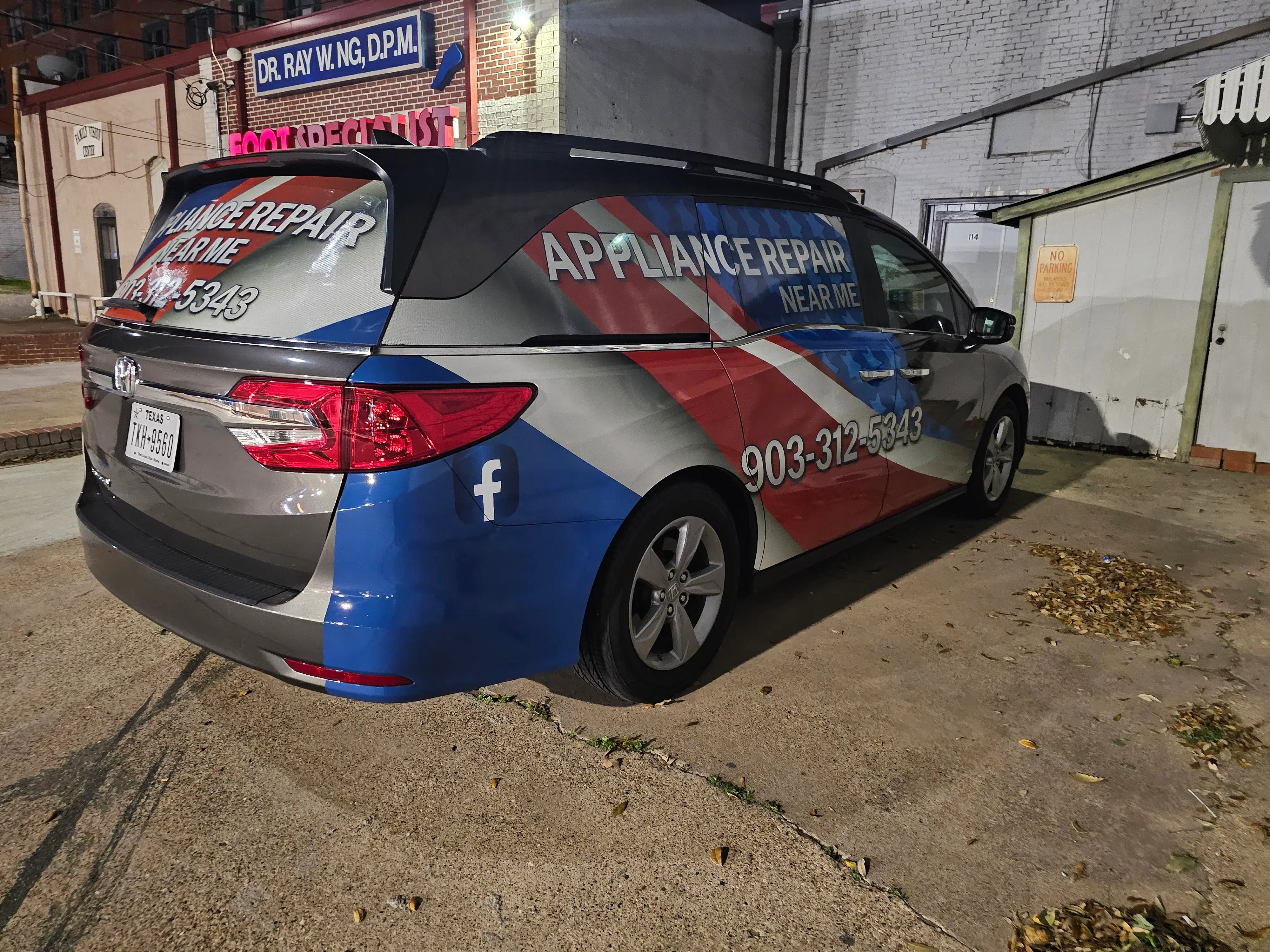 custom-car-wrap-appliance-repair-patriotic-minivan.webp