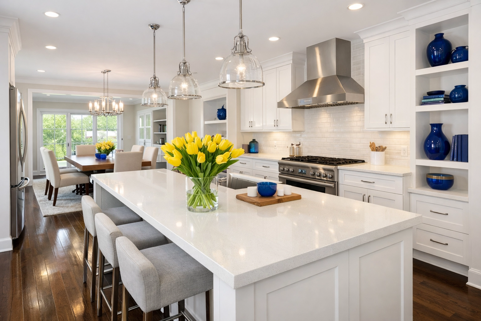Spotless modern kitchen with quartz countertops and hardwood floors after a professional Hopkinton house cleaning.