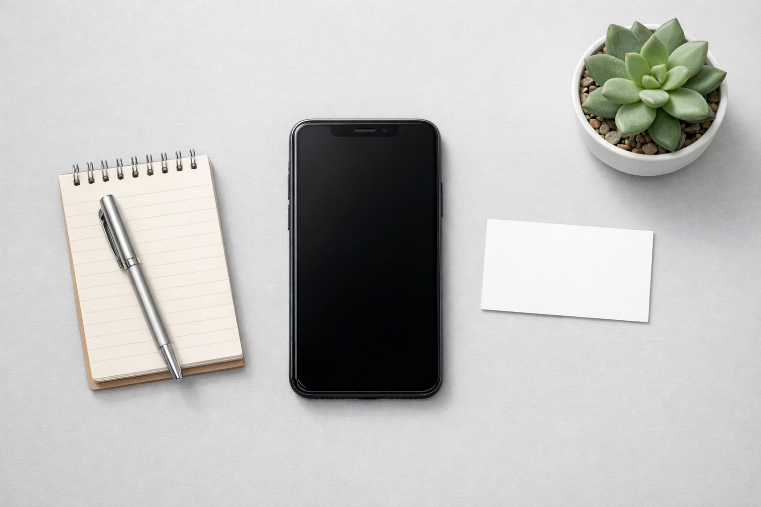 Professional business setup with smartphone and organized contact details for AI visibility