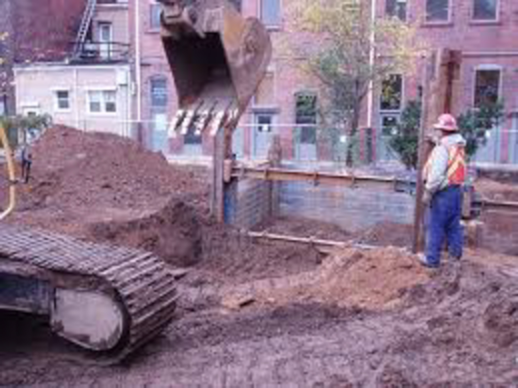 Excavator and Crew at Urban Redevelopment Site