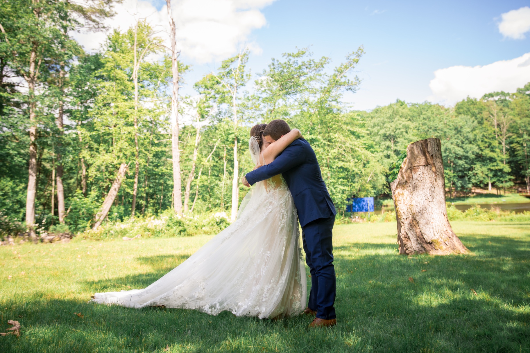 A bride and groom embrace in a heartfelt first look