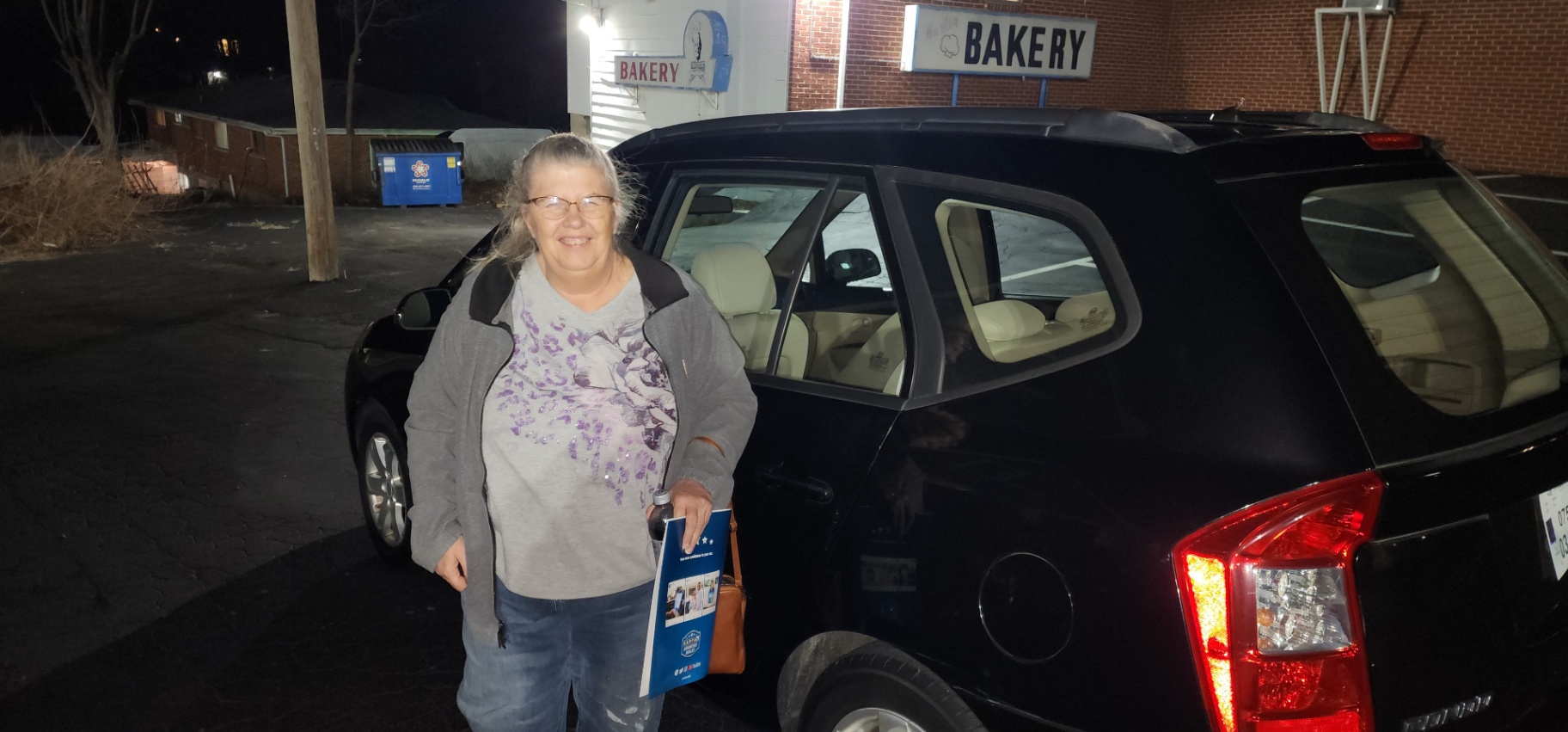 Satisfied customer at Grateful Motors with newly purchased vehicle