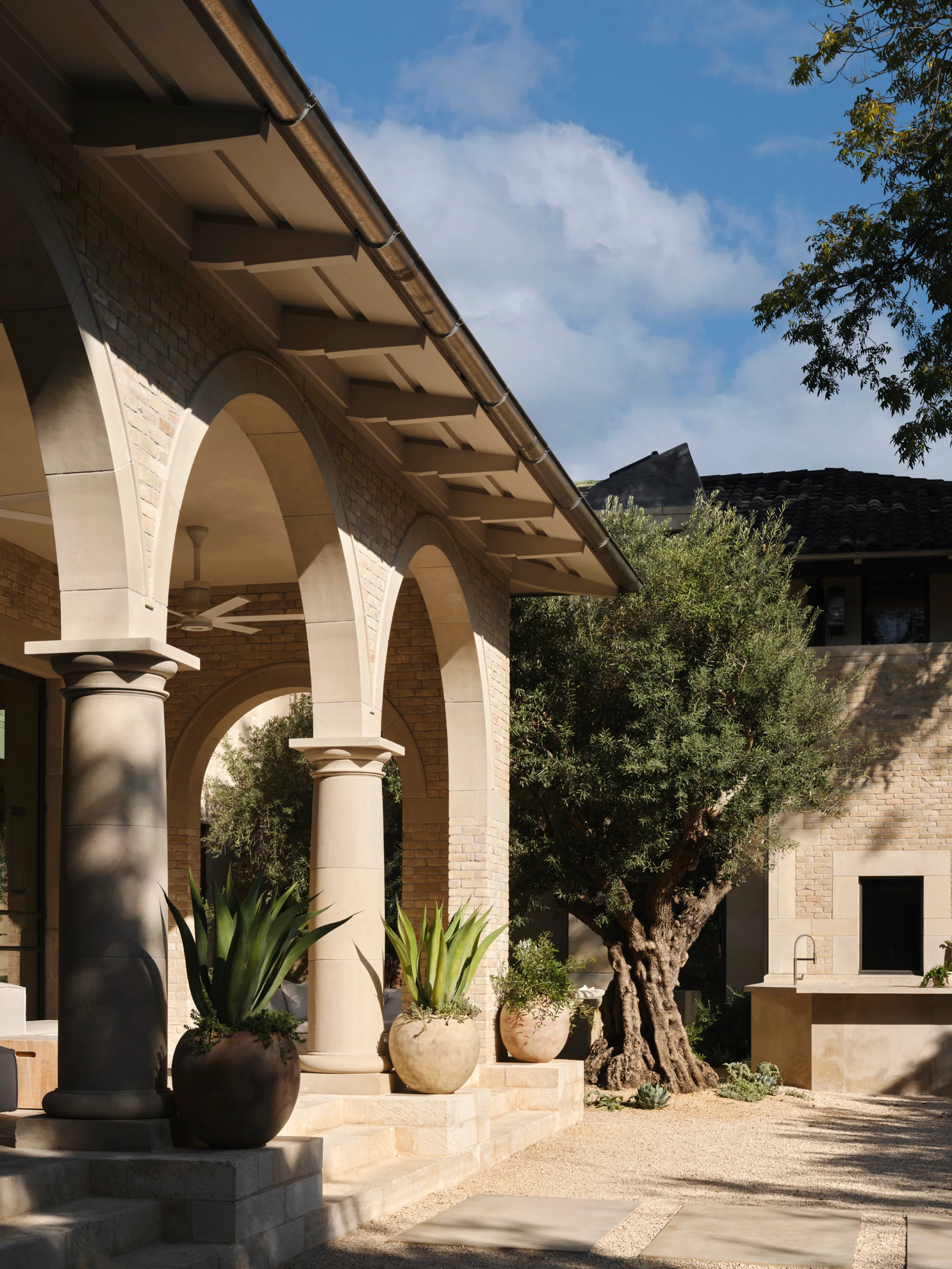 Elegant Mediterranean-style exterior showcasing meticulous surface preparation and professional finishing