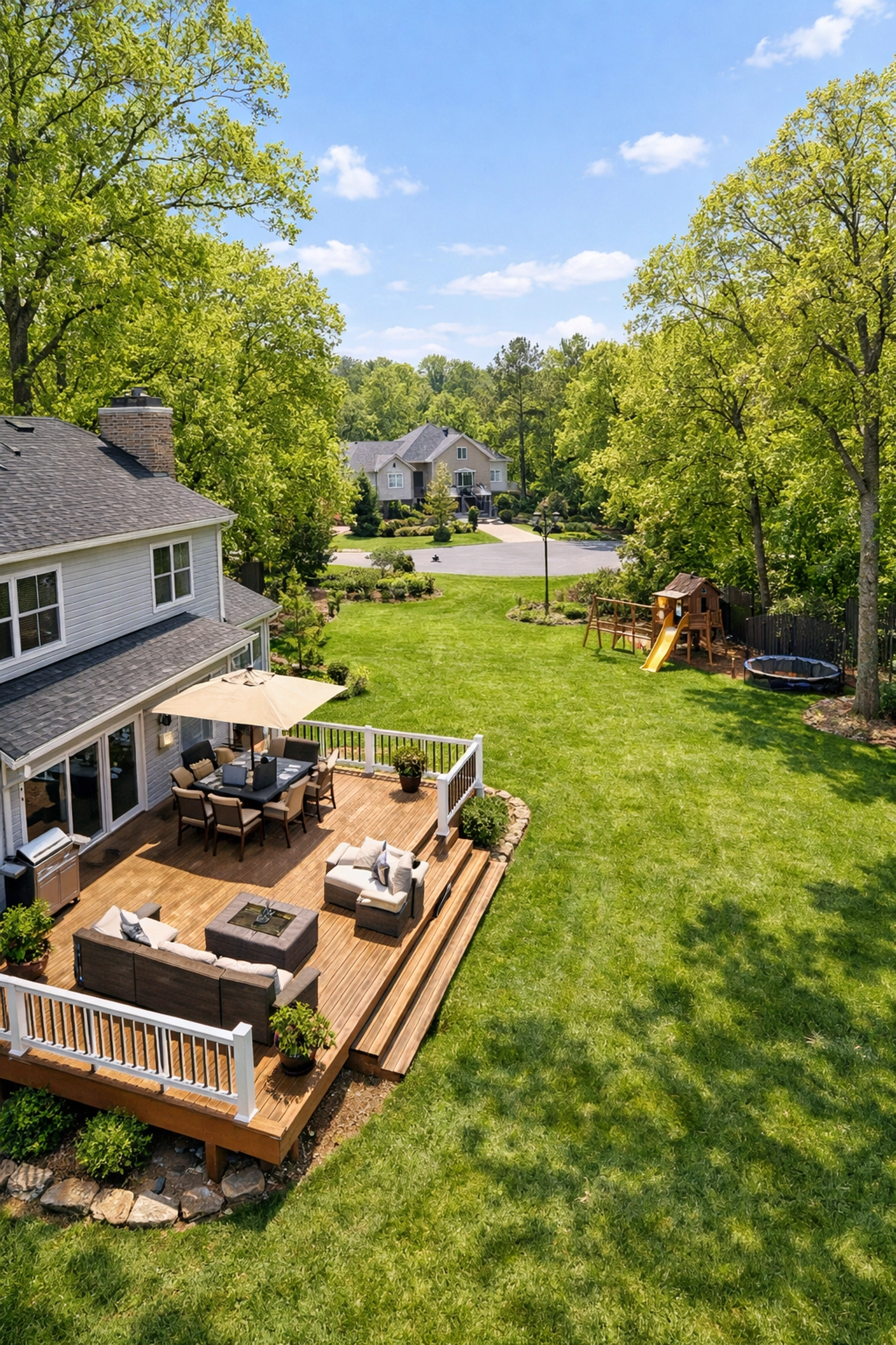 Spacious modern two-story home in High Point NC with a large backyard and wooden deck.