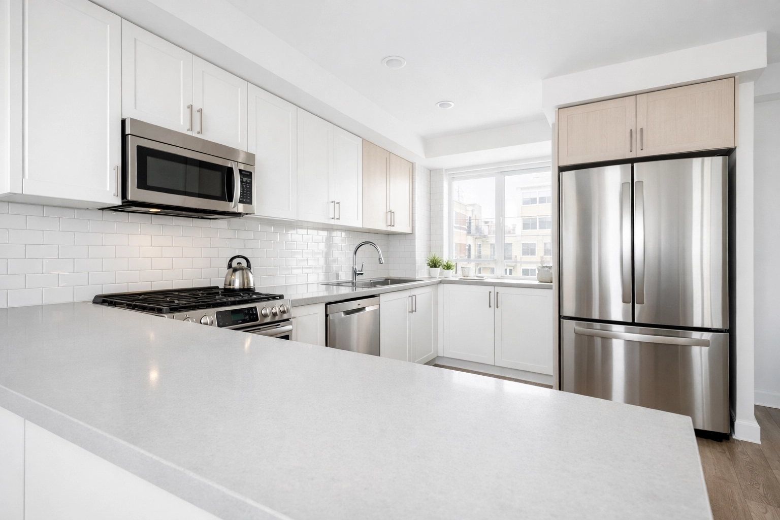 Spotless rent-ready apartment kitchen with clean countertops and stainless appliances