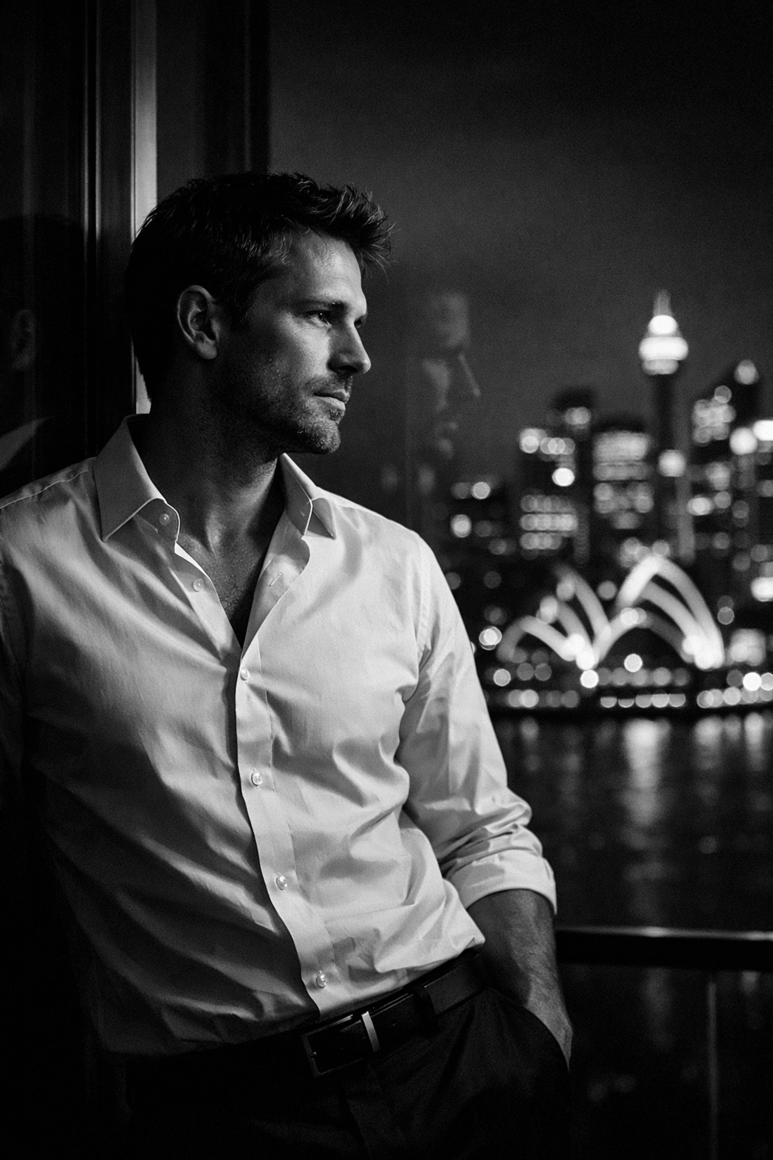 A Sydney professional reflecting on his dating life while looking out at the city skyline.