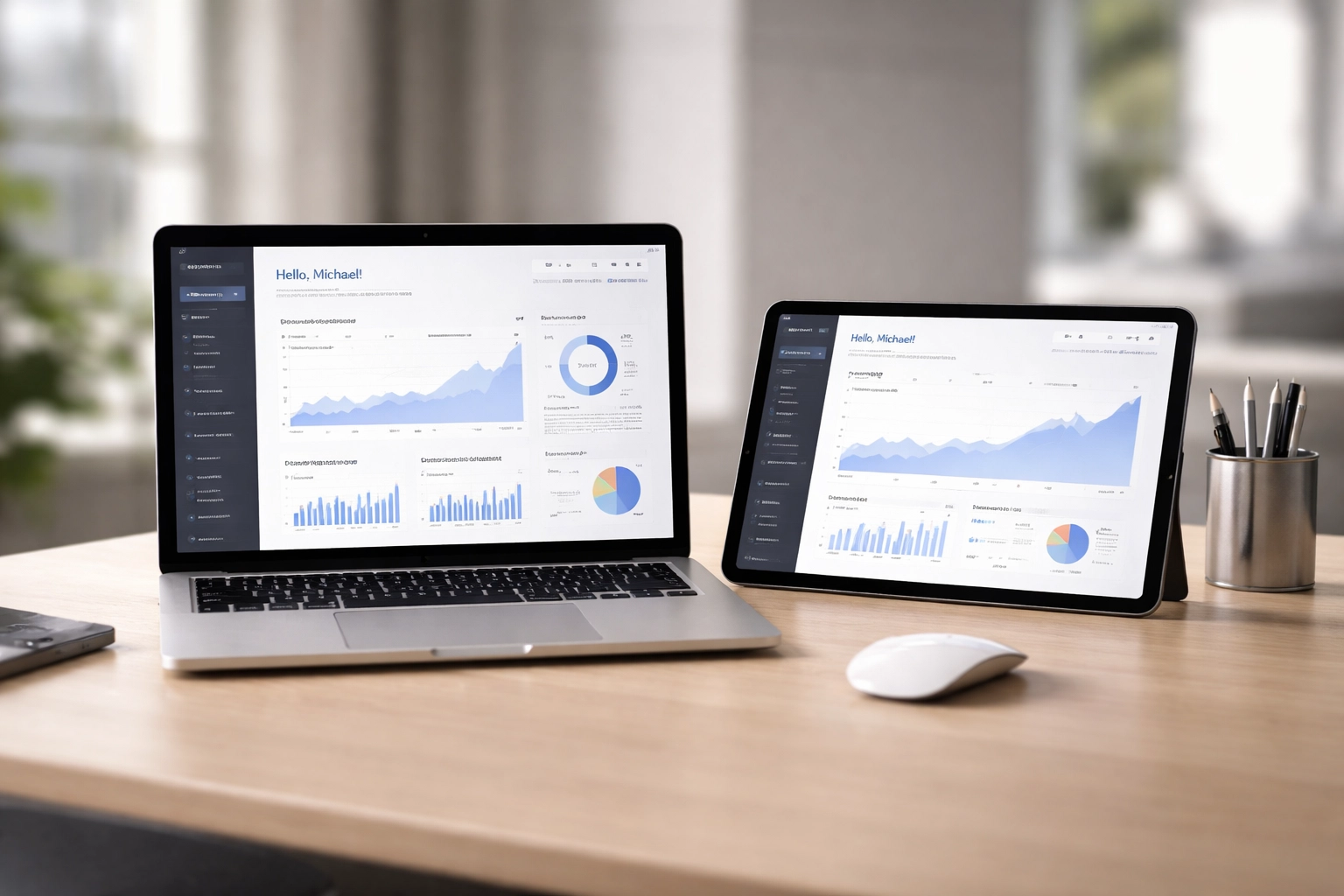 Laptop and tablet displaying charts in a bright office, representing scalable tax software technology