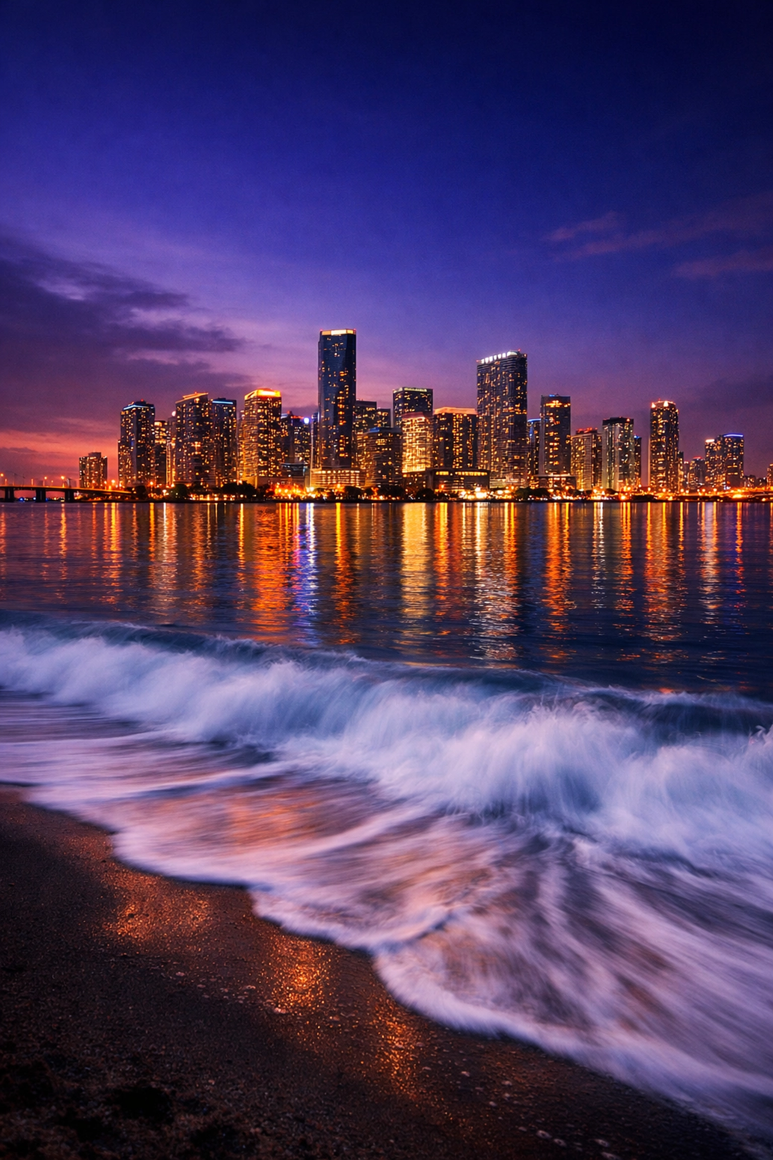 Fine art landscape photography of the Miami skyline at twilight reflecting on the ocean.