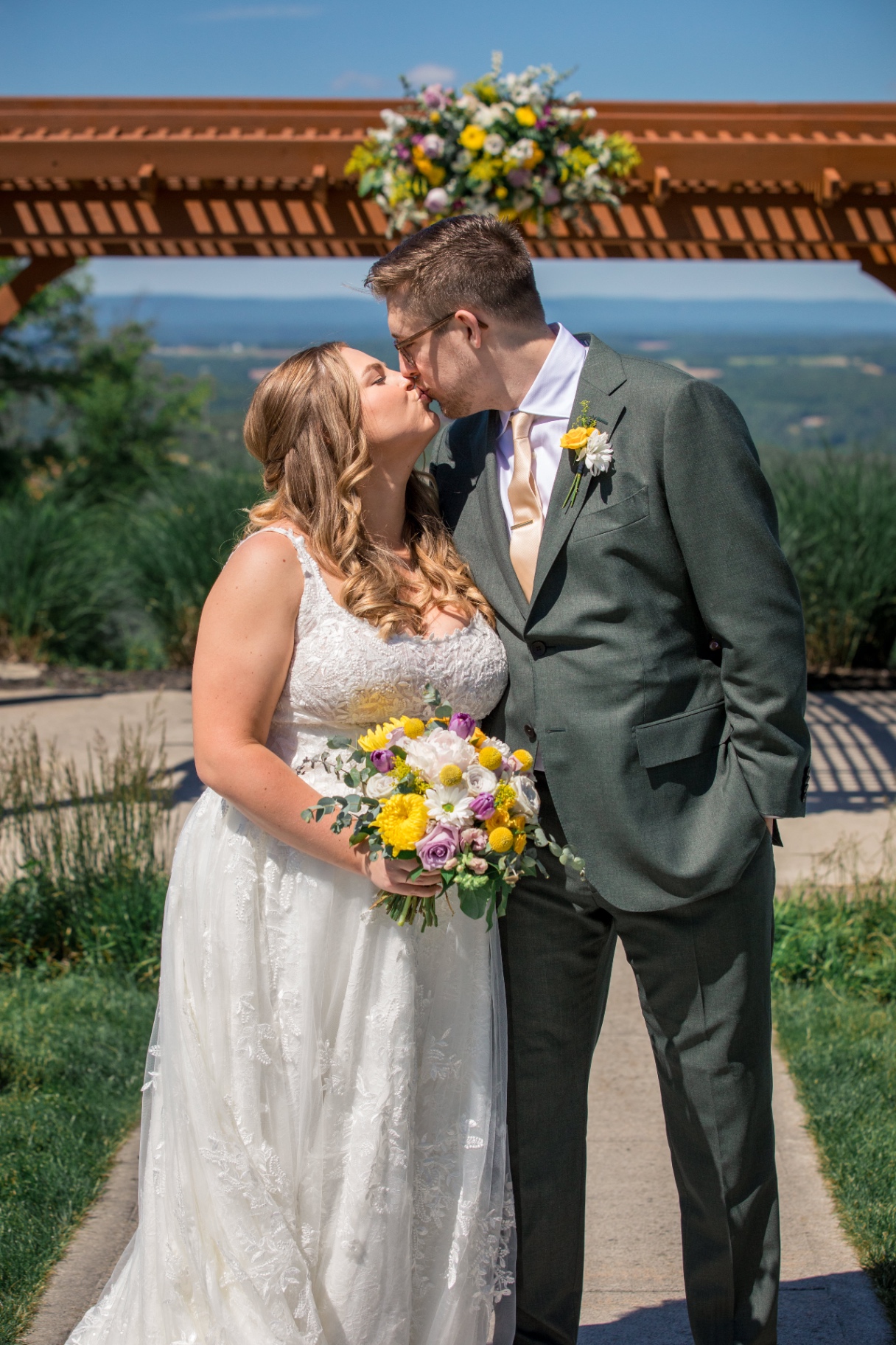 Bride and Groom Sharing a Kiss Outdoors