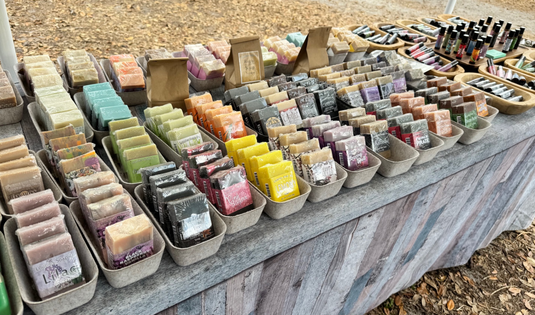 A collection of natural beeswax lip balm tubes in various flavors for long-lasting hydration.