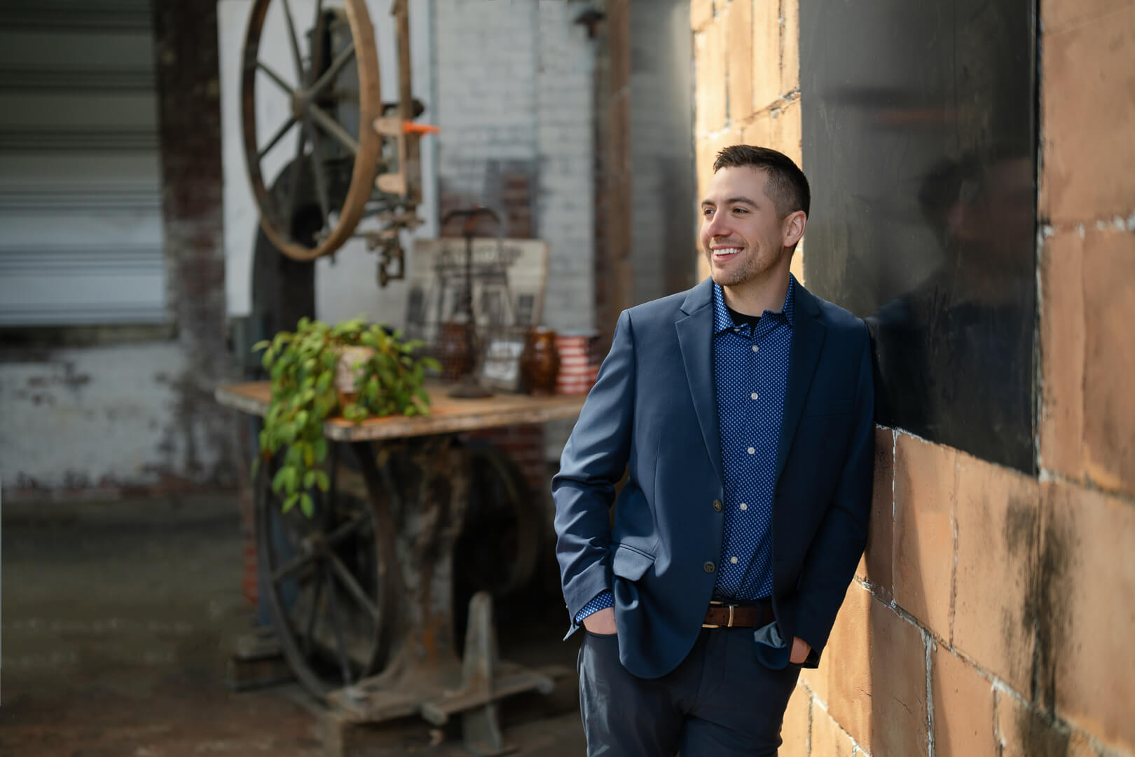 Professional brand photography portrait of a confident man in a blue suit