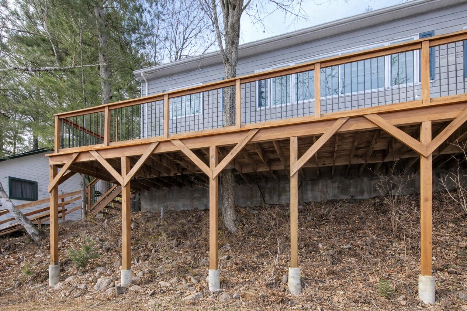Custom-crafted raised timber frame deck structure