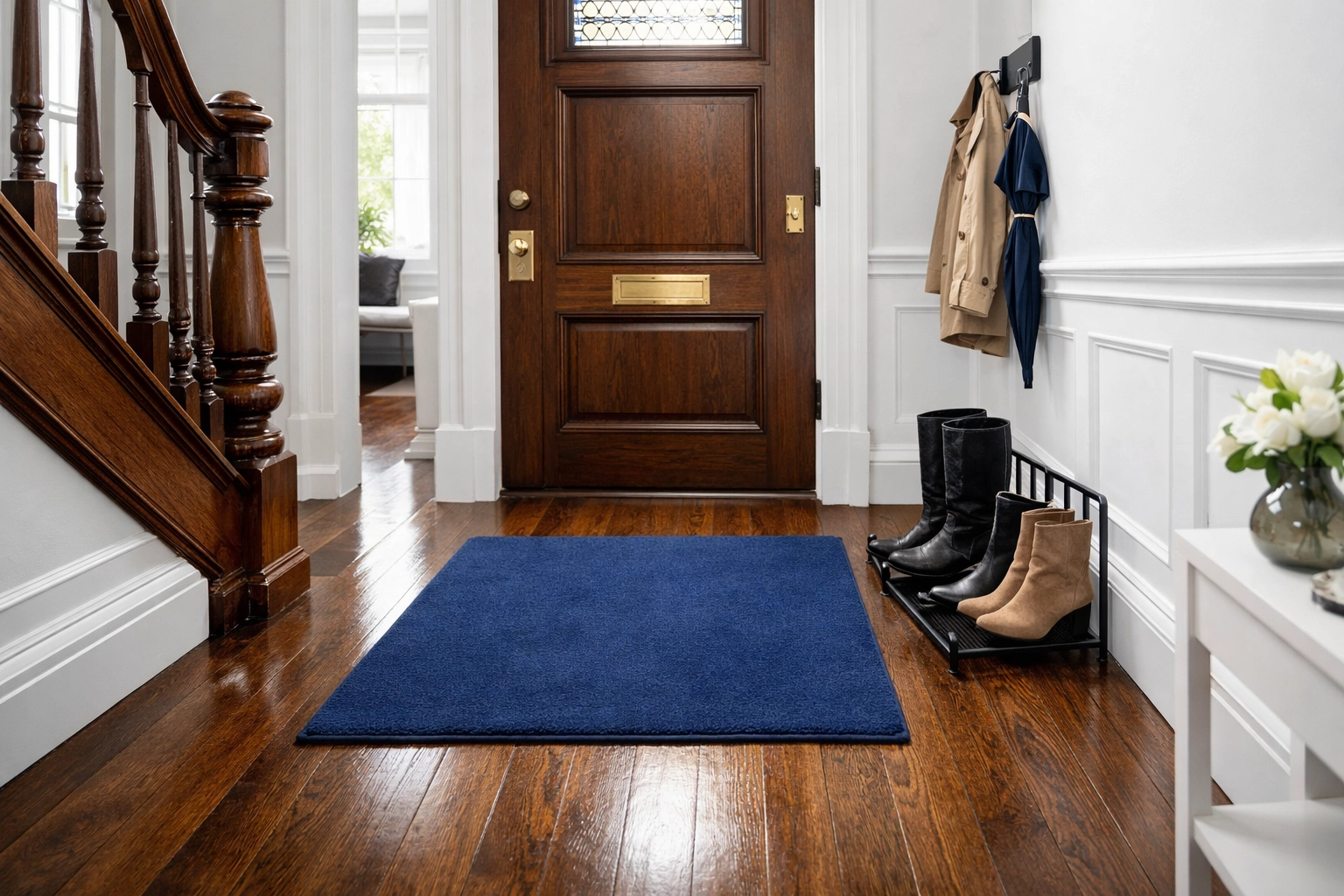 Clean Beacon Hill entryway with a rug and boot rack to prevent salt and dirt during apartment cleaning Boston.