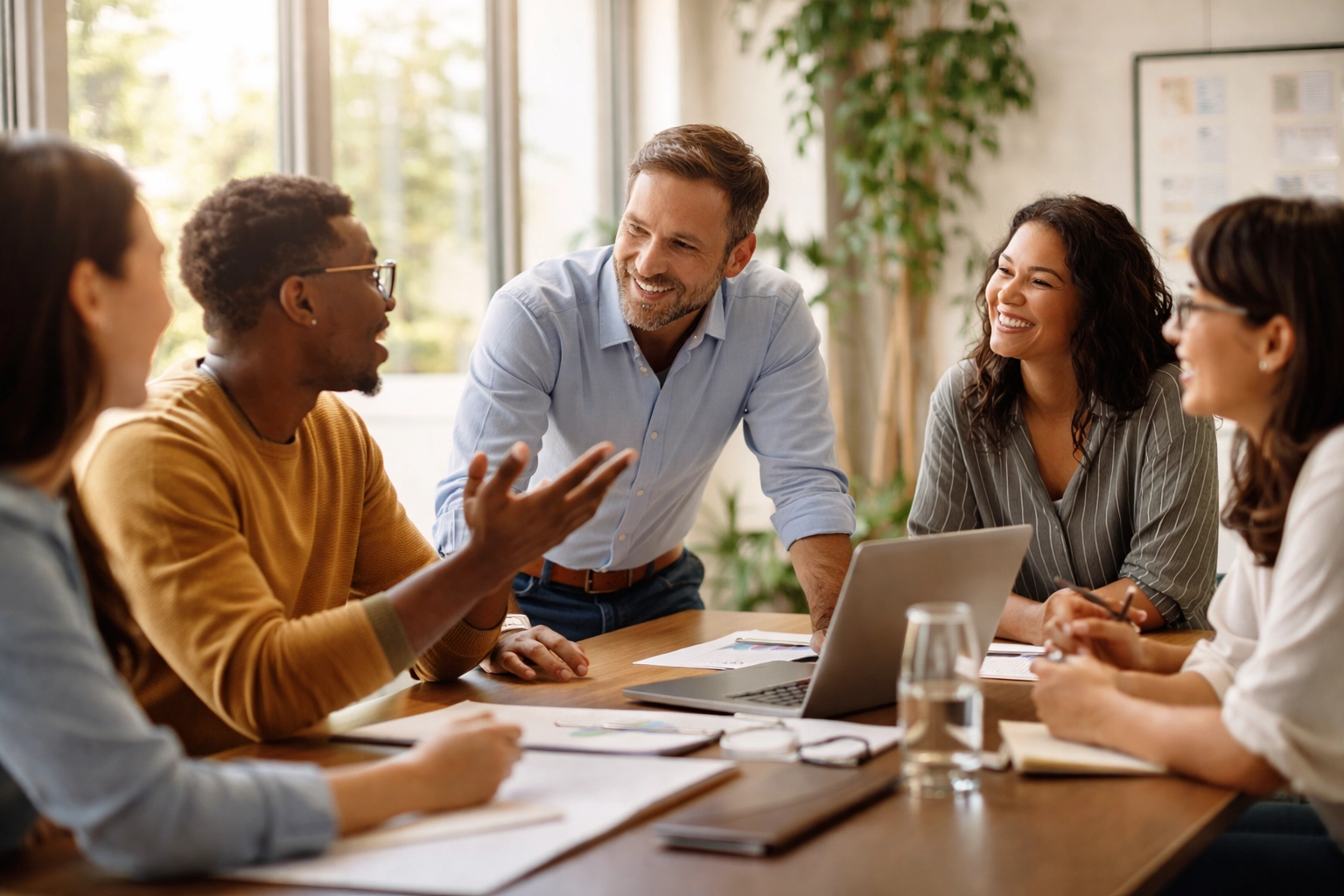 Servant leader listening to diverse team during AI readiness and training meeting