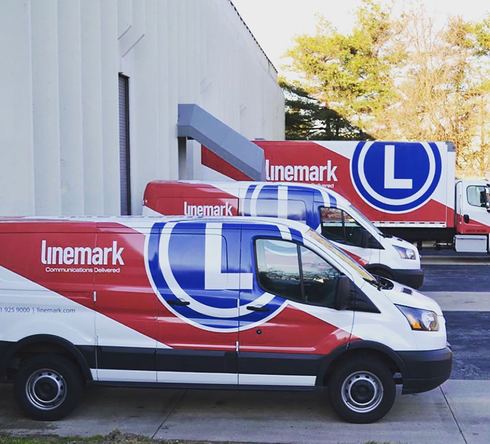 Linemark delivery fleet outside the facility