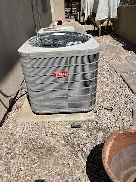 bryant-ac-unit-on-concrete-pad-arizona-gravel-landscaping.jpg