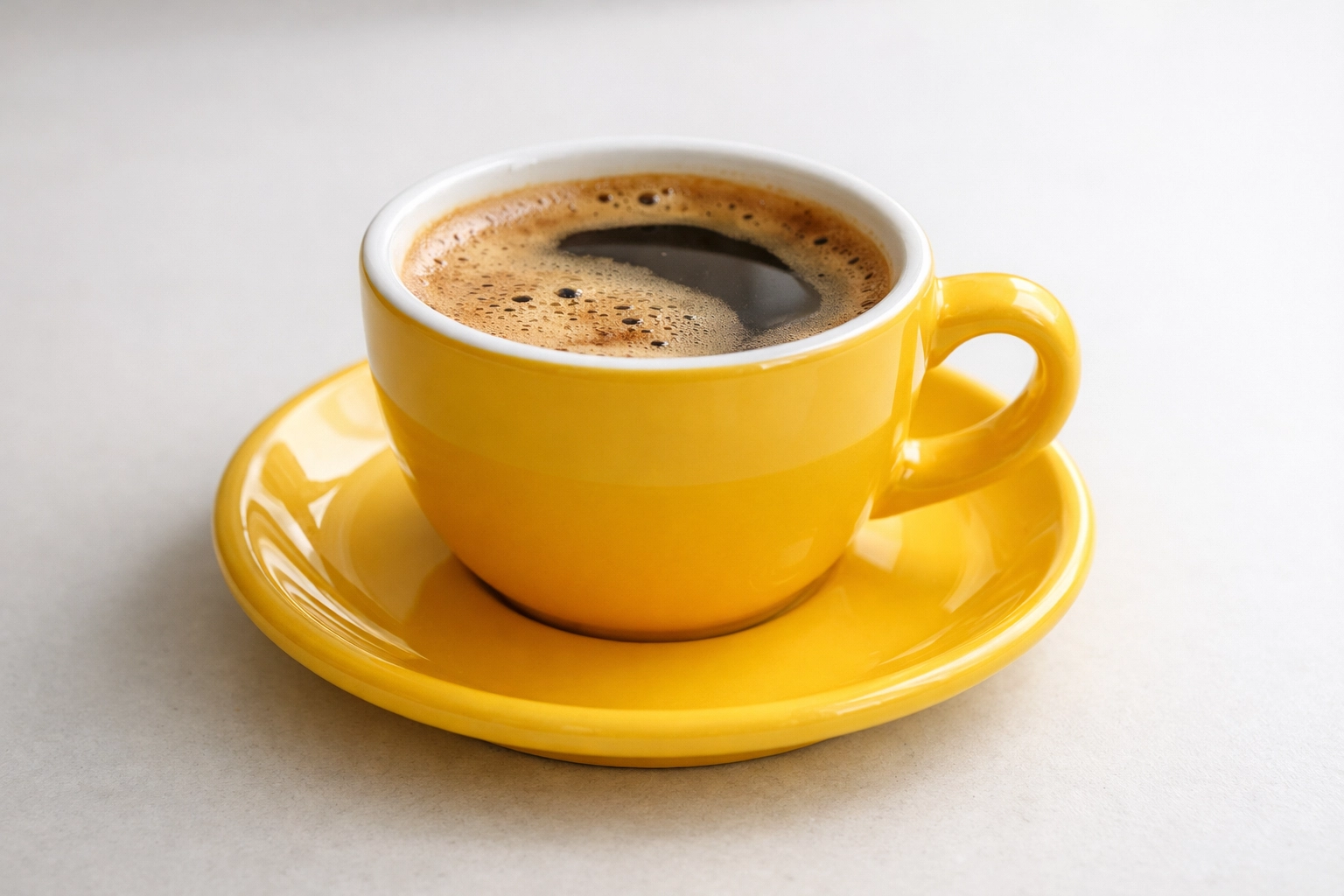 Bright yellow coffee cup close-up