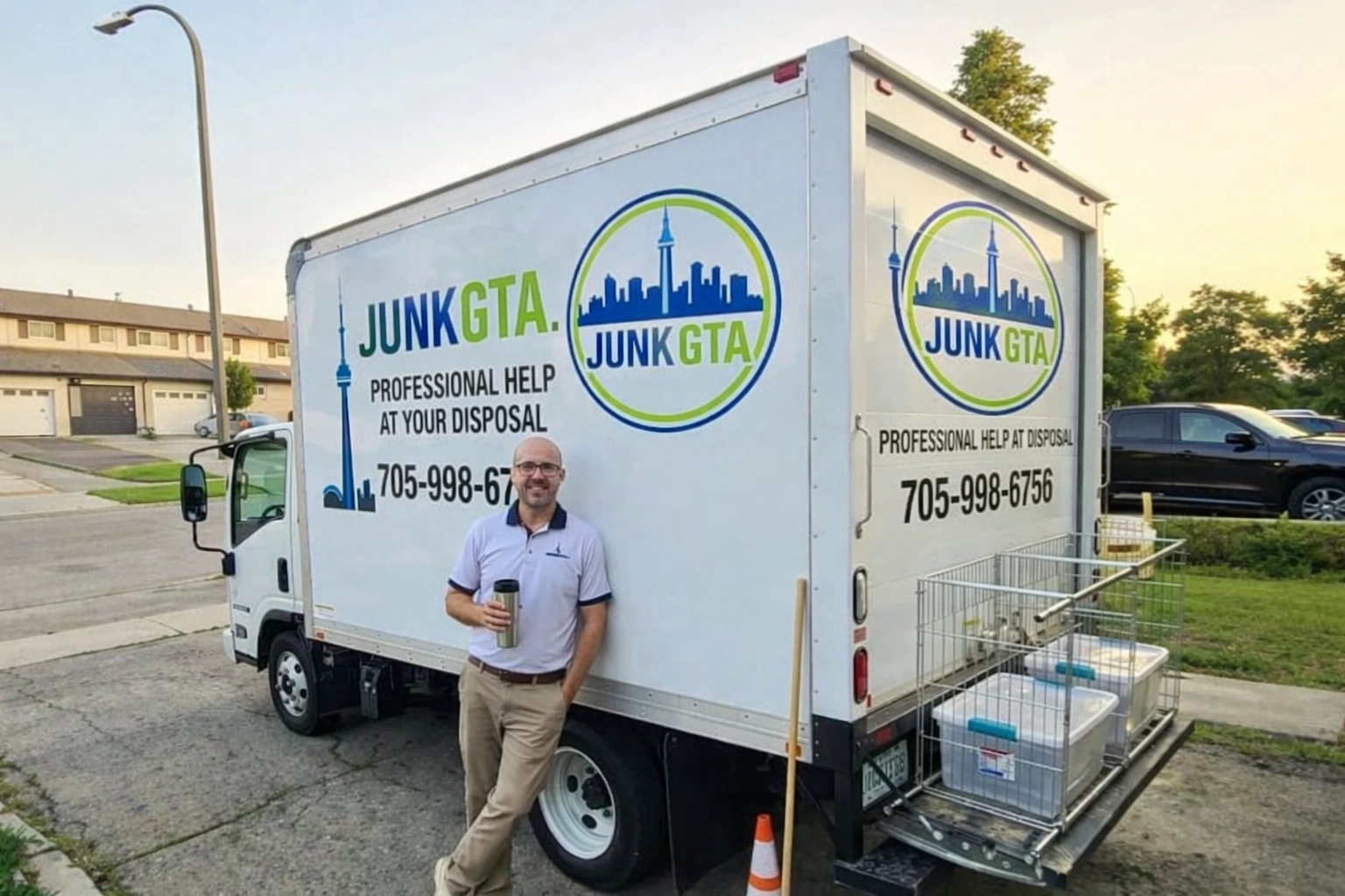 Junk GTA team member beside a truck in a residential neighborhood