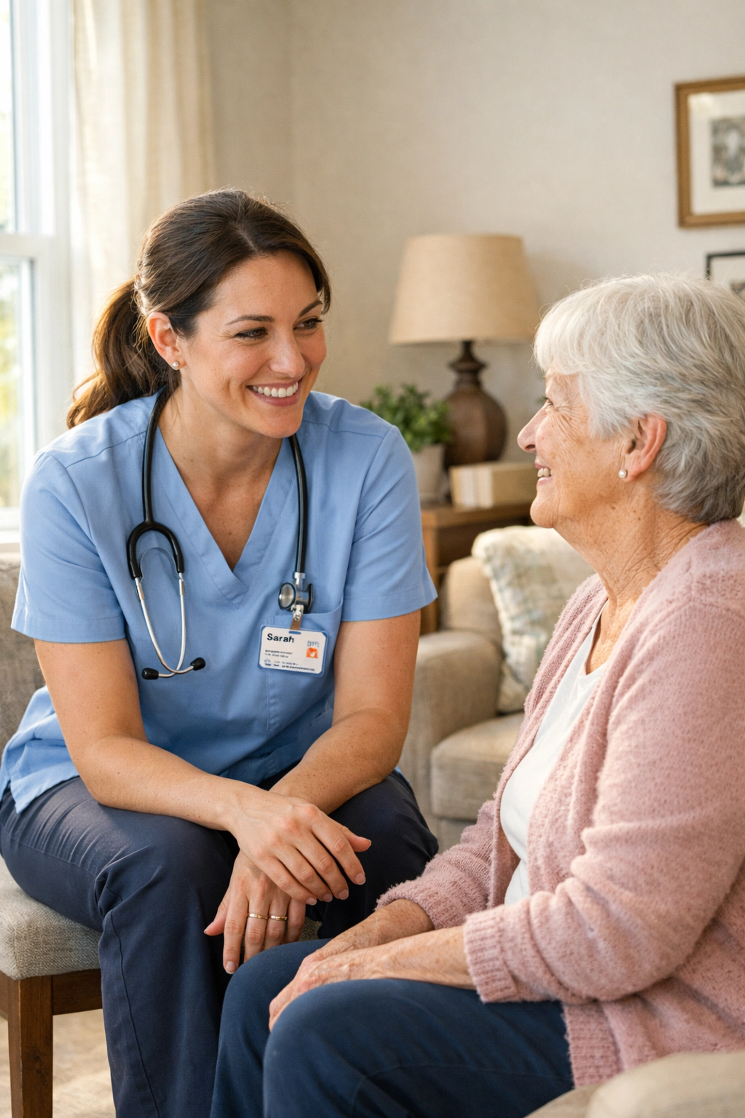 A physical therapist discussing a home mobility assessment with a senior woman in a living room.