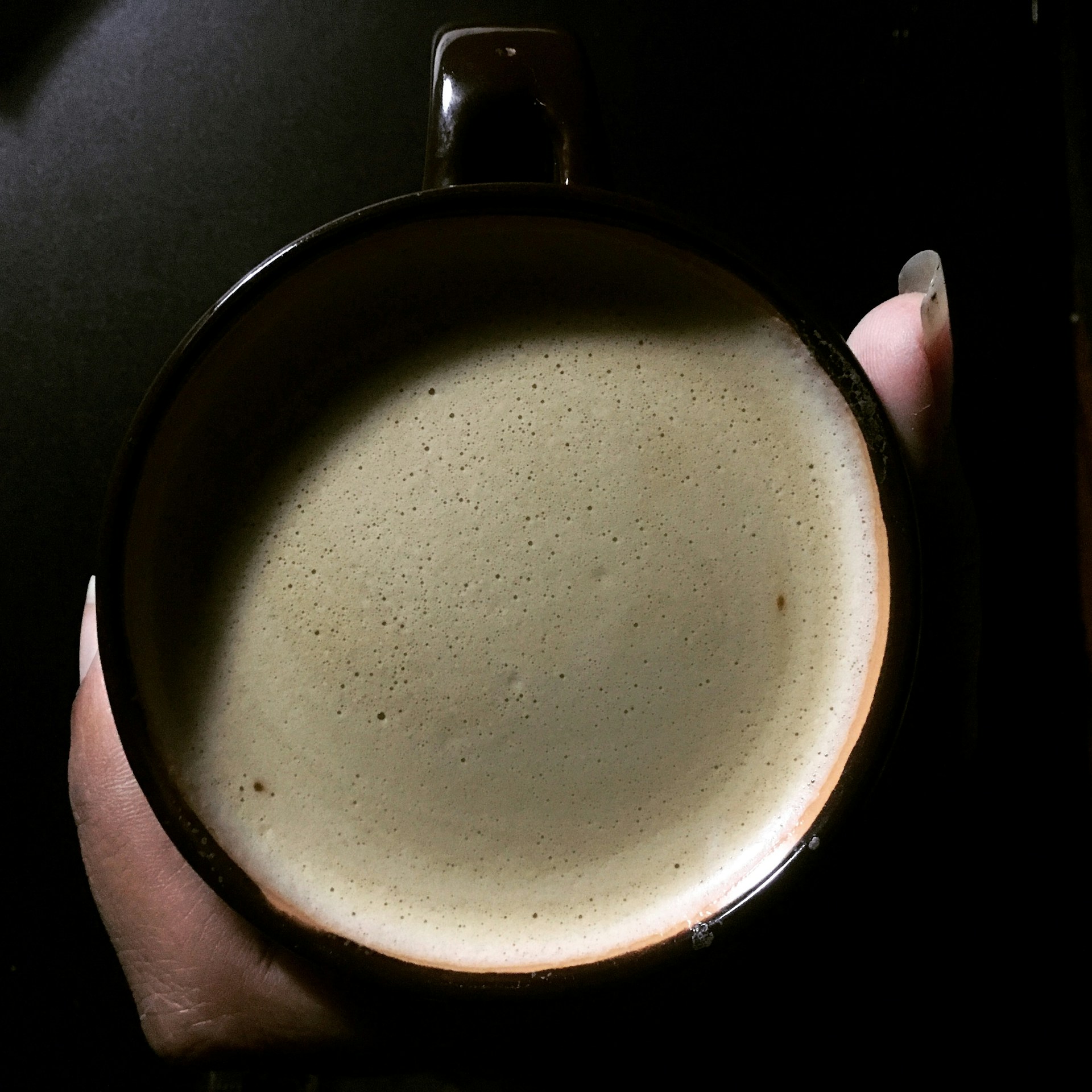 Hand Holding Coffee Mug