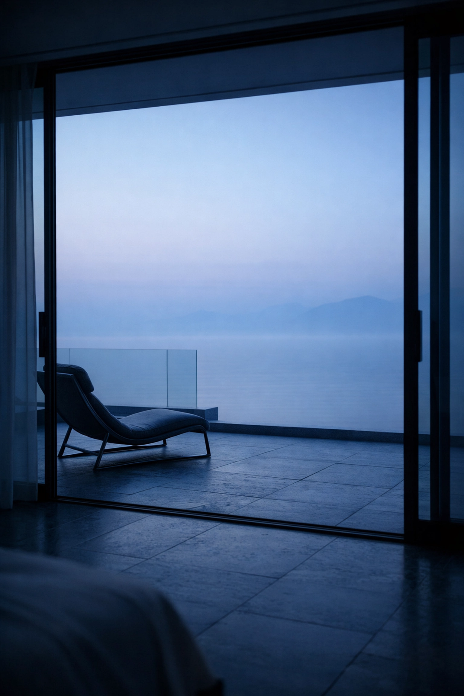 Luxury hotel balcony overlooking a misty horizon, representing the innovative future of hospitality in 2026.