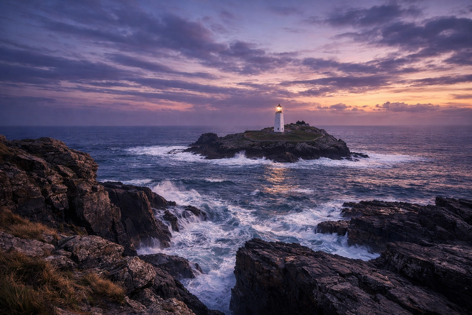 Godrevy Lighthouse in Cornwall at sunset, a serene location for scattering ashes at sea.