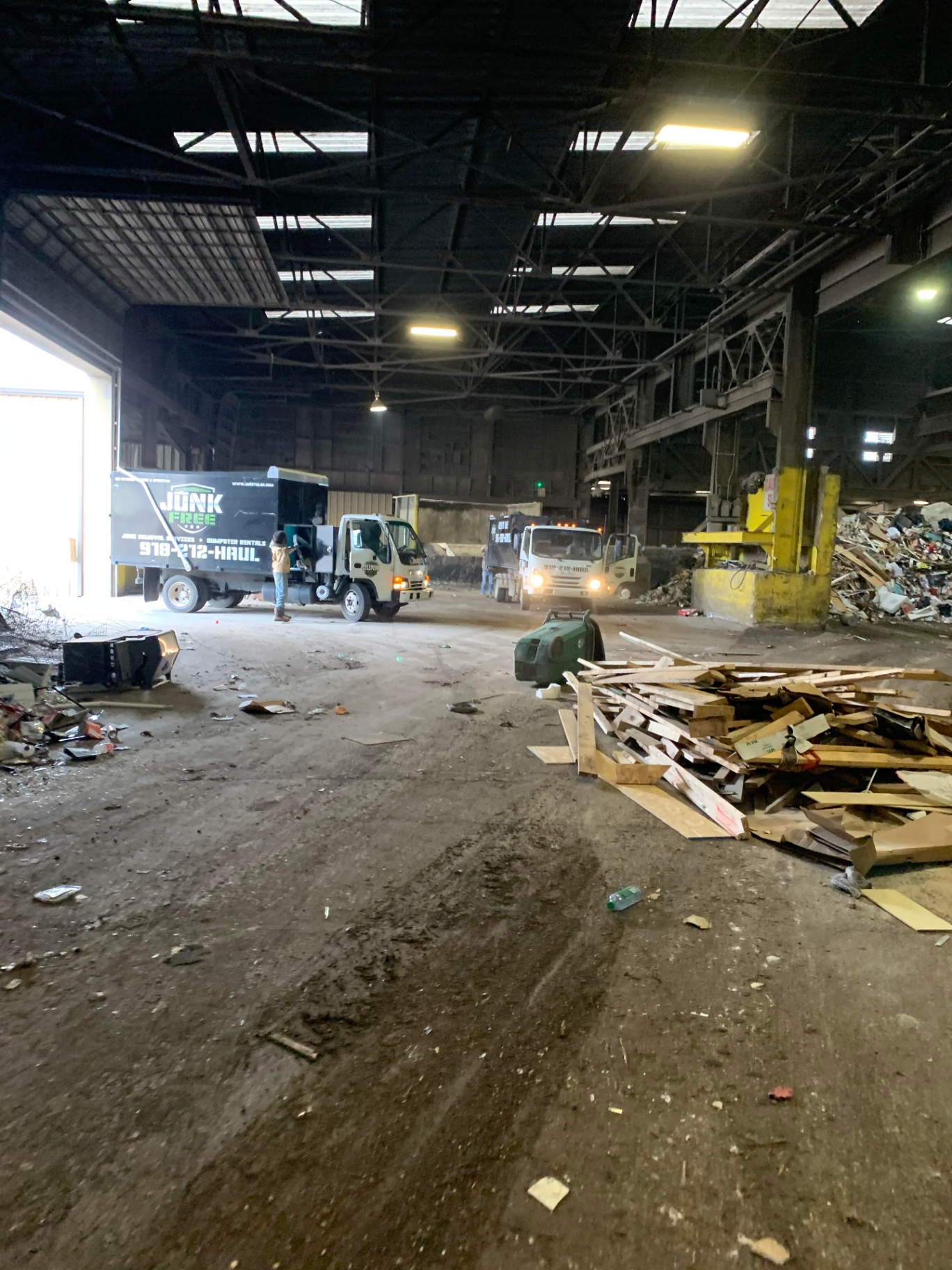Junk Free LLC trucks unloading debris