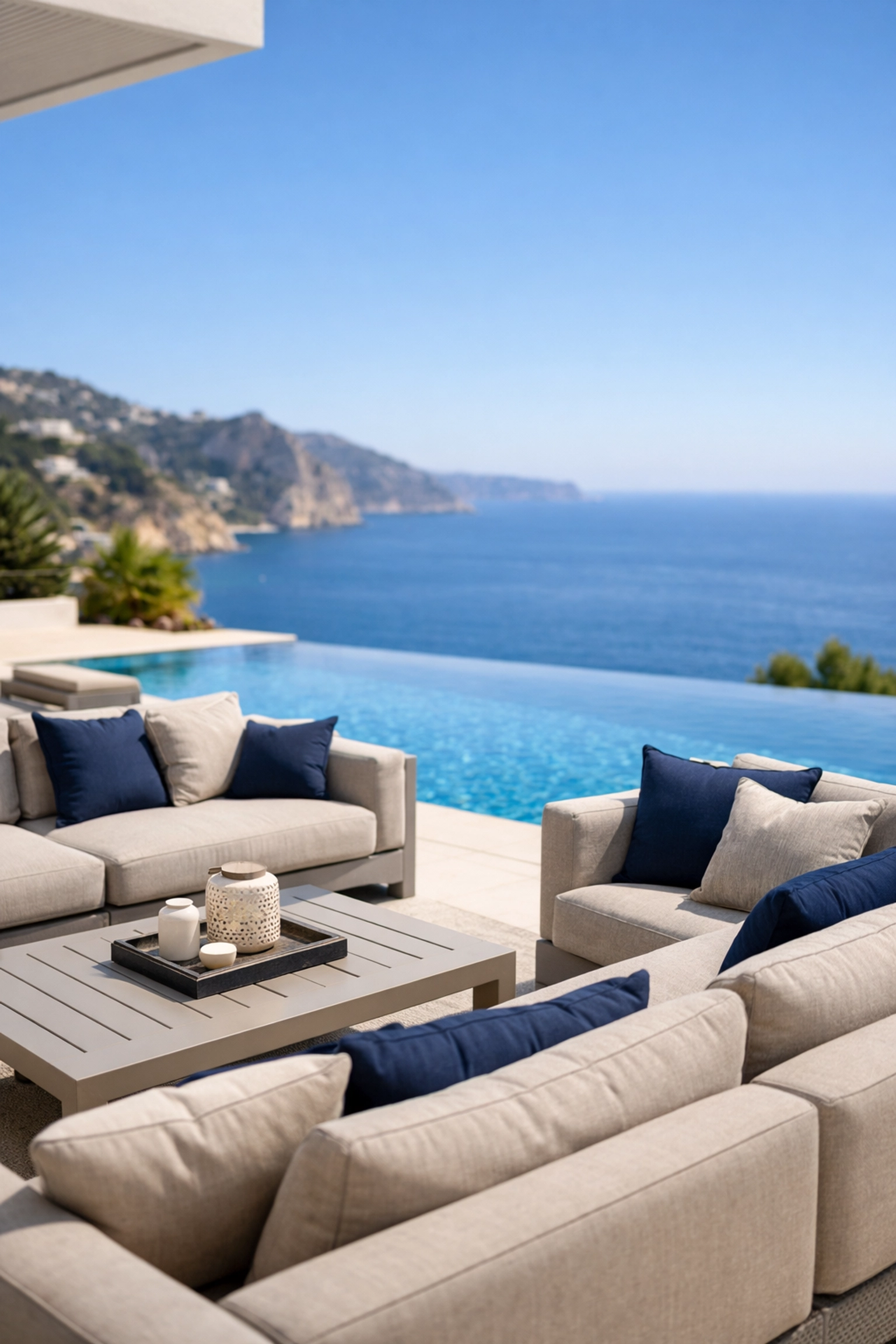 Durable luxury outdoor sofas on a Spanish villa terrace with Mediterranean views.