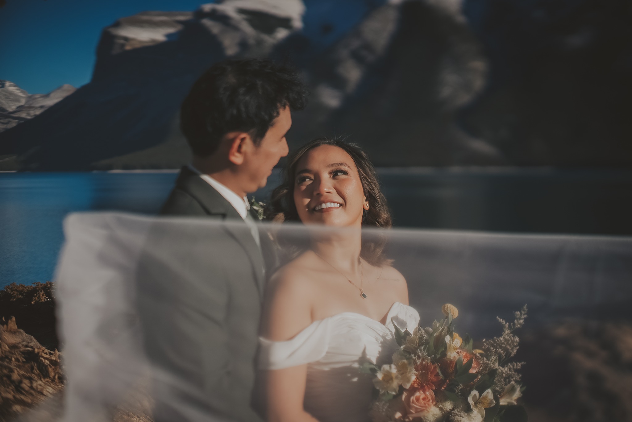 Couple eloping at a mountain lake in Banff