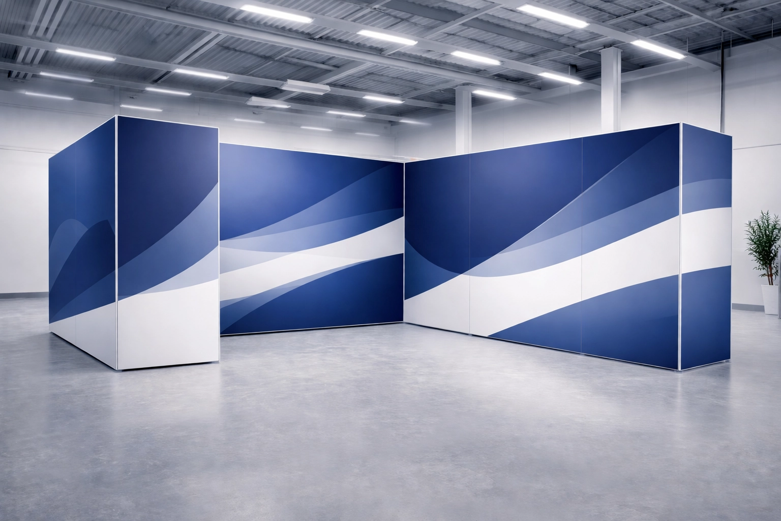 Partially assembled BeMatrix modular exhibition stand frame system with tension graphics in a spacious warehouse, showcasing professional exhibition stand installation.